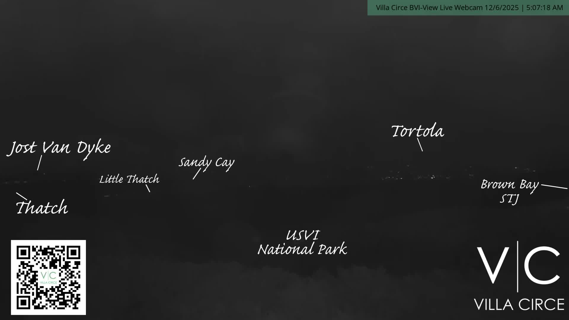 The image depicts a dark nighttime view of distant islands across the water, illuminated by faint lights, under clear weather conditions.