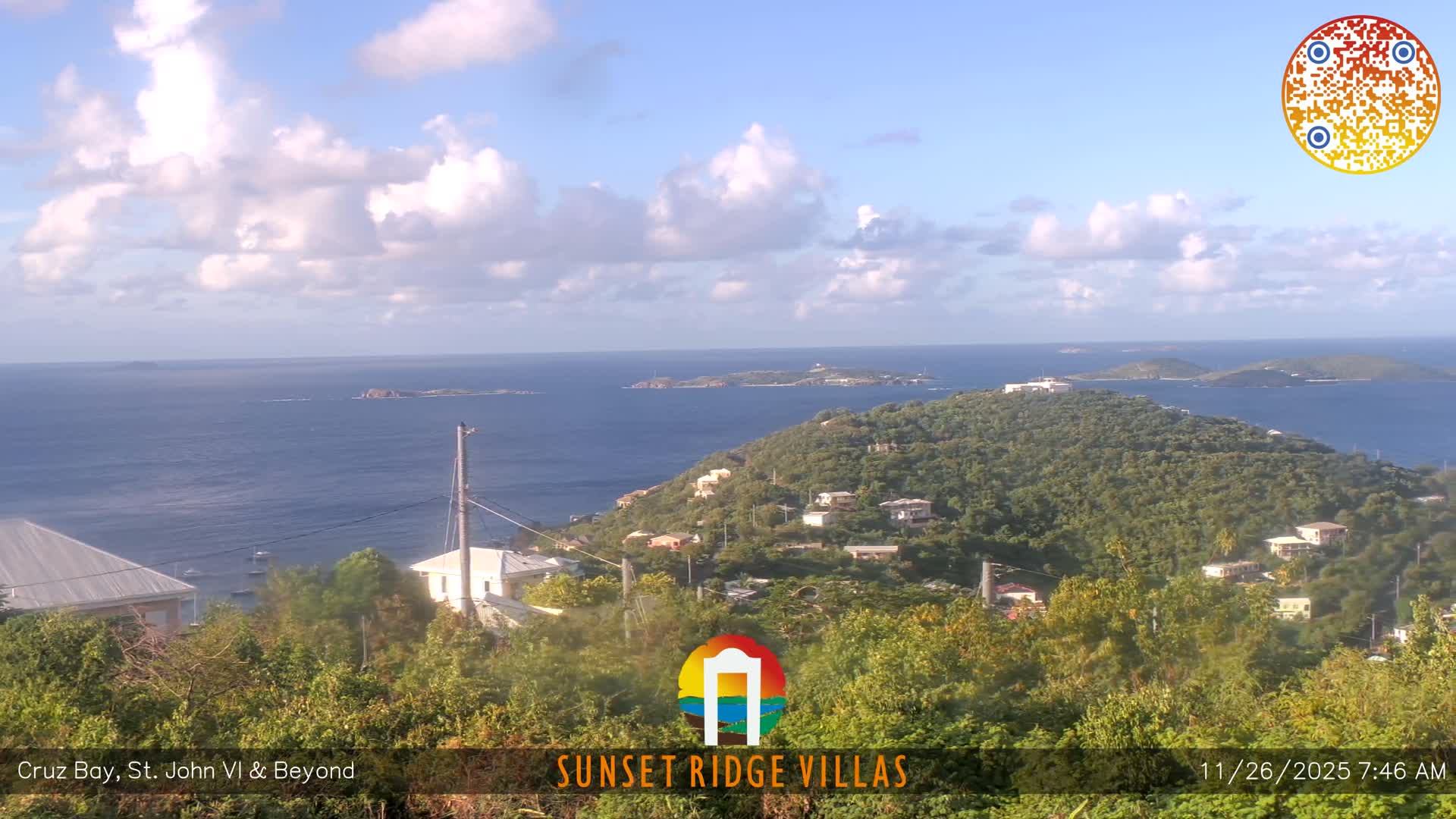 The image displays a dark, blurry nighttime outdoor scene of a distant landscape with scattered lights, significantly obscured by rain or condensation on the camera lens.