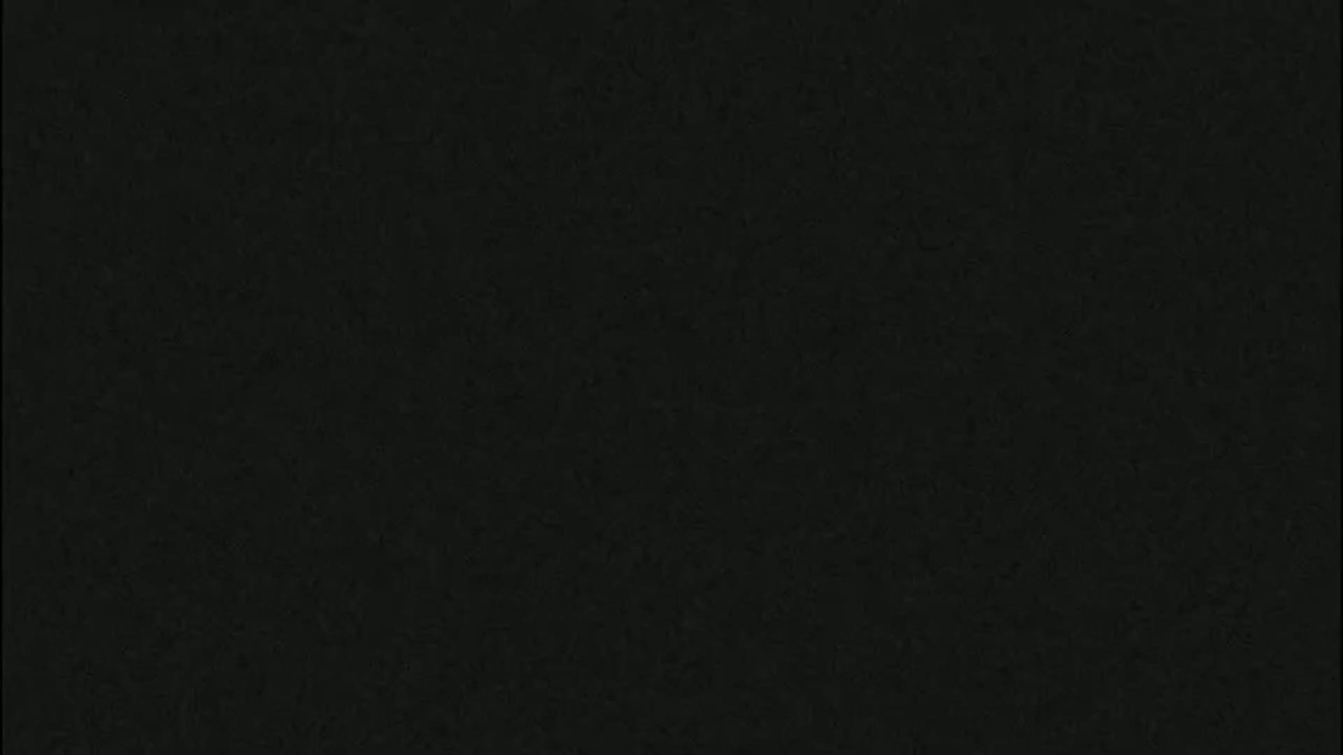 The image shows a solid dark-gray/black textured surface.