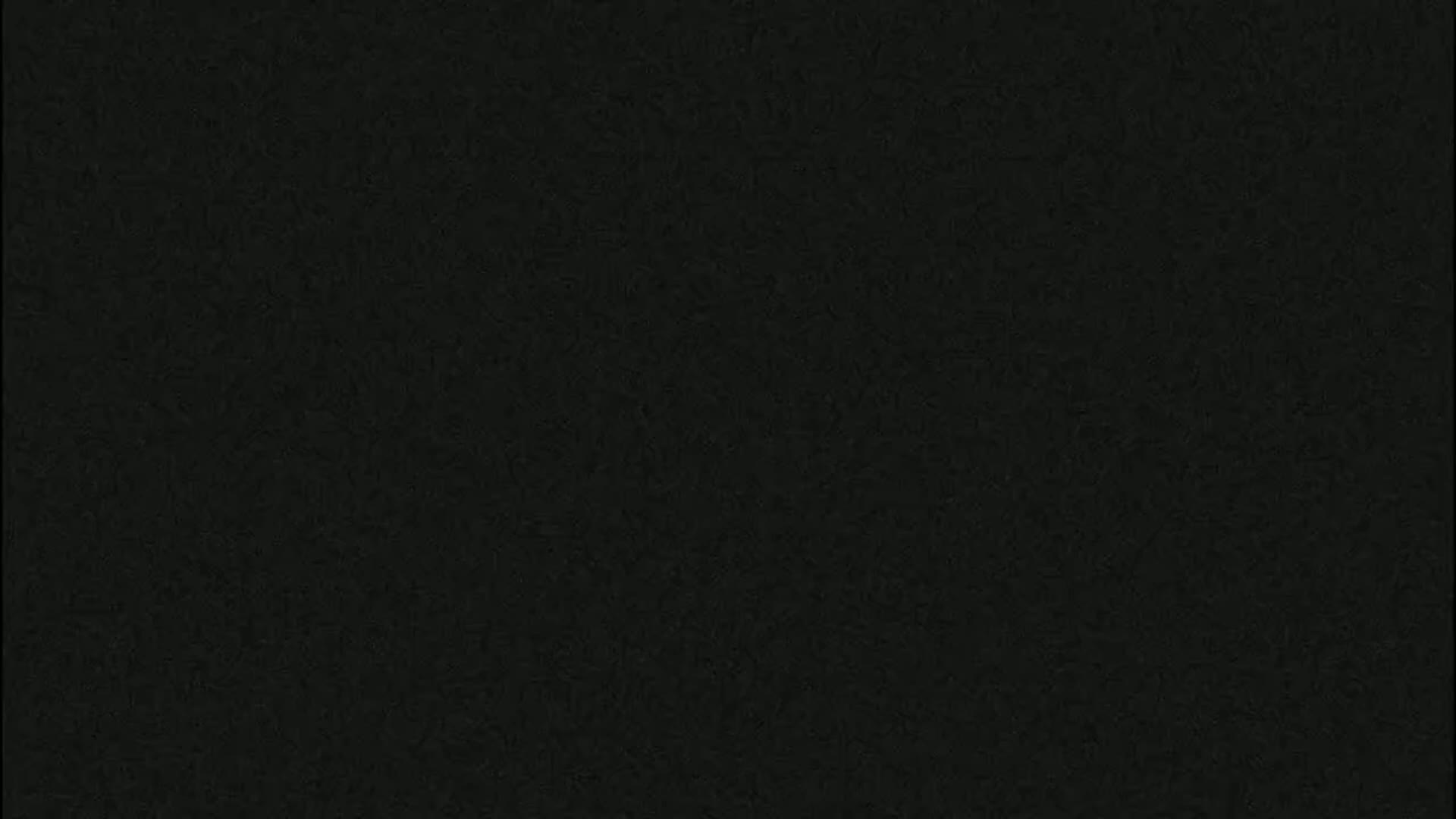 The image shows a uniformly dark gray or black textured surface.