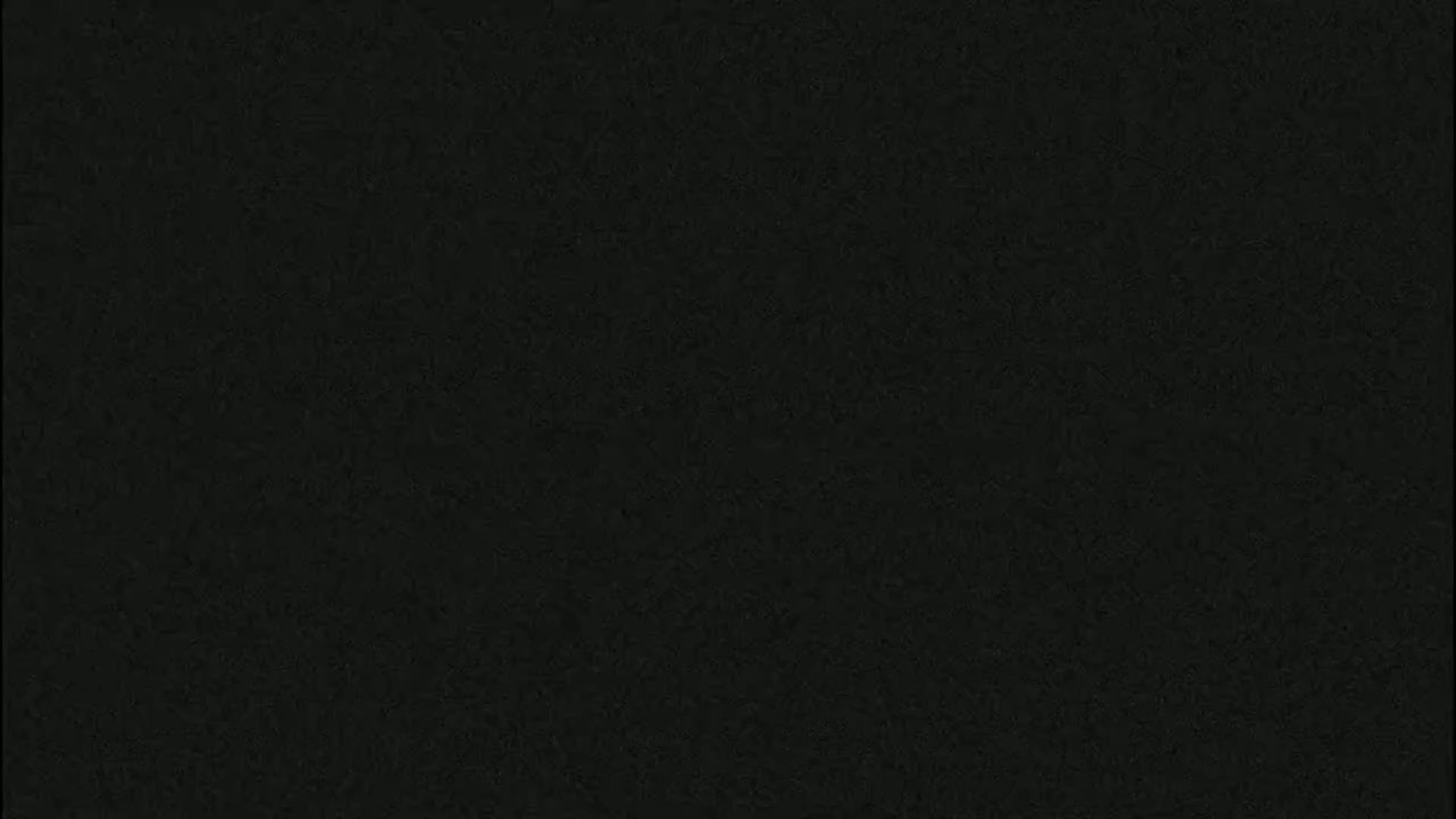 The image is a solid dark-grey/black textured background.