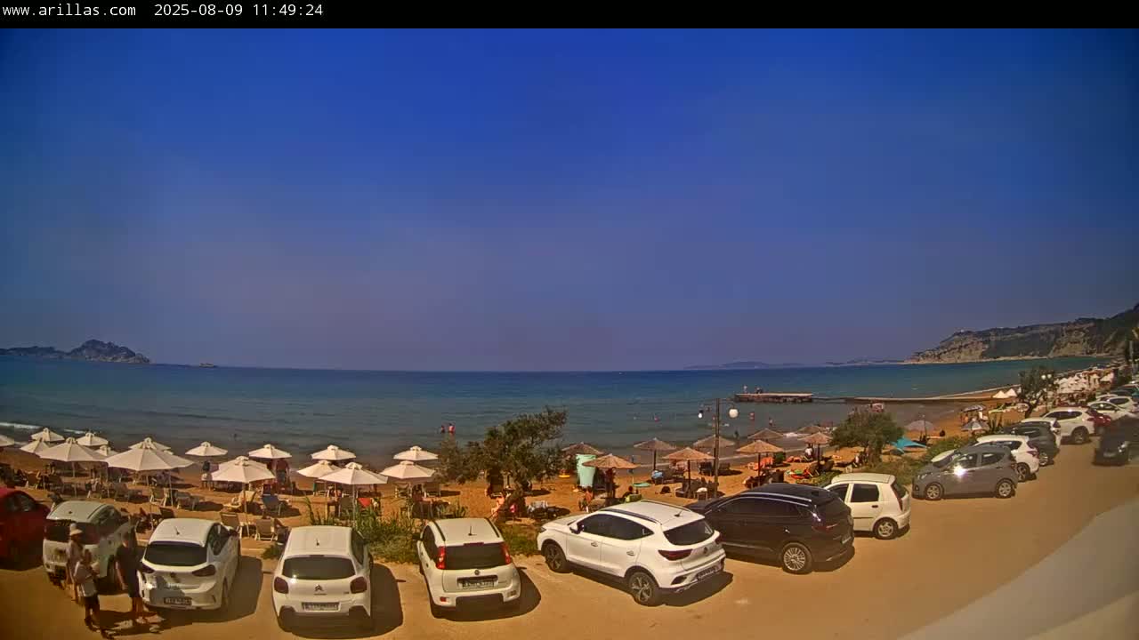 Corfu, Paralia Arillas Beach Live Cam - Arillas Agiou Georgiou, North Corfu (Vóreia Kérkyra), Corfu (Kérkyra), Ionian Islands (Periféreia Ioníon Níson), Greece