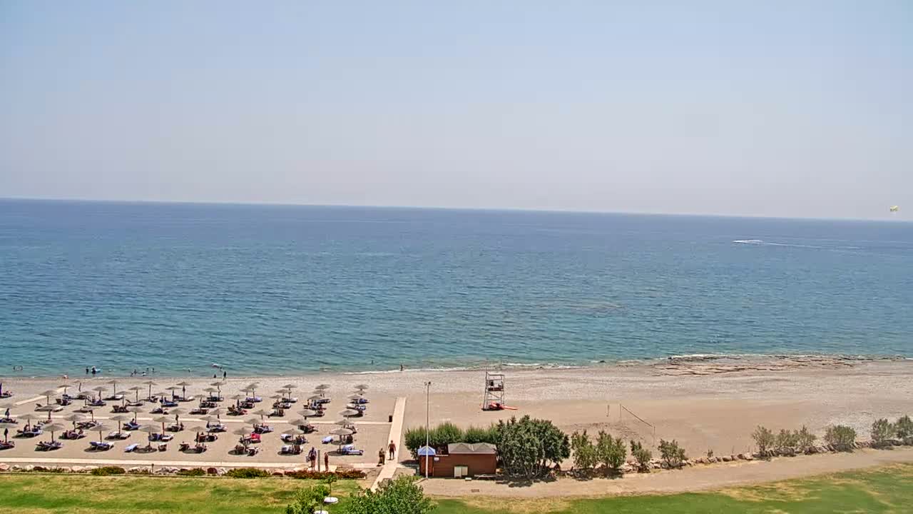 Rhodes, Paralia Faliraki Beach Northeast End Live Cam - Ammoudes, Rhodes (Ródos), Dodacanese,  South Aegean (Periféreia Notíou Aigaíou), Greece