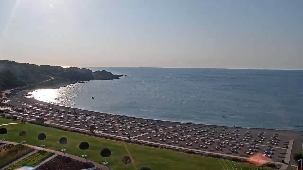 Rhodes, Paralia Faliraki Beach Northeast End Live Cam - Ammoudes, Rhodes (Ródos), Dodacanese,  South Aegean (Periféreia Notíou Aigaíou), Greece