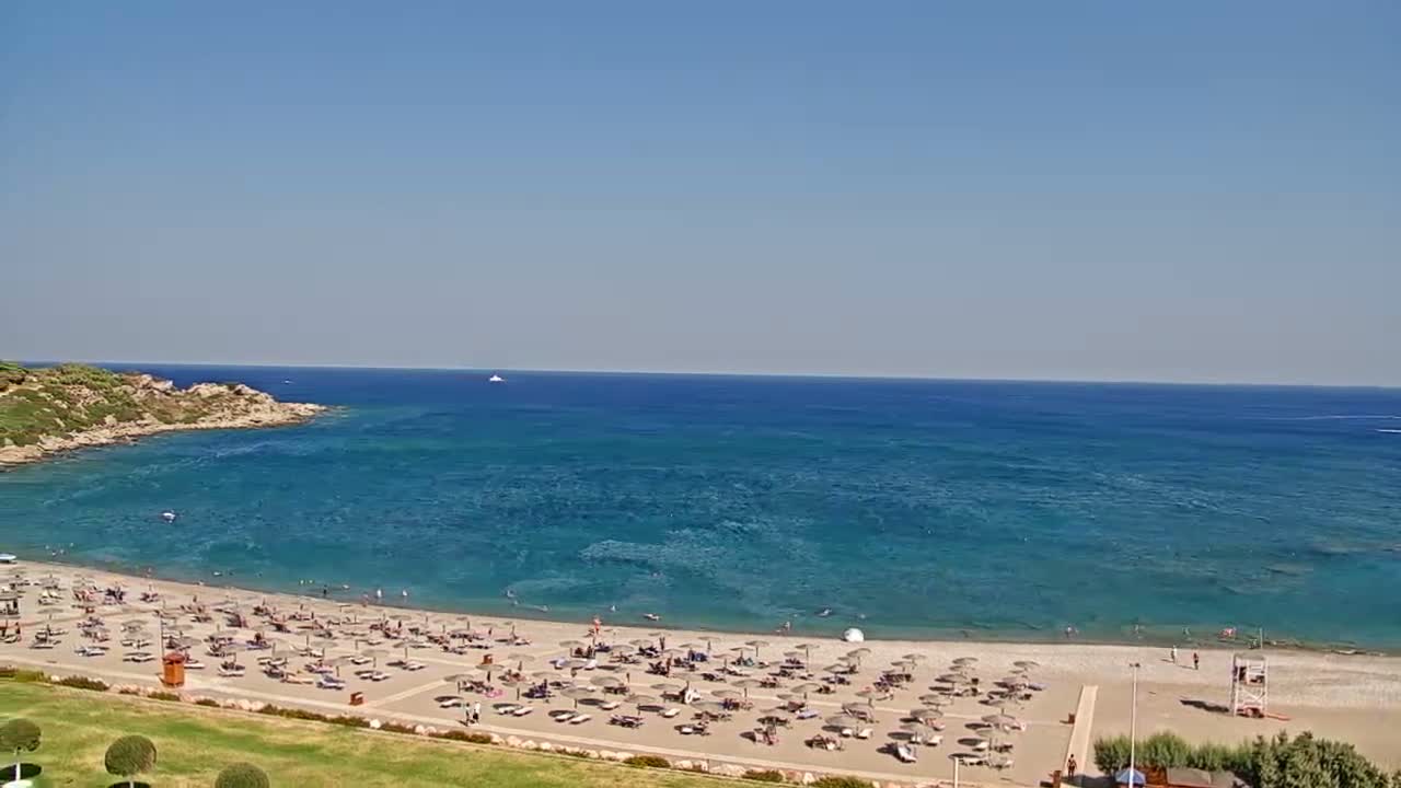 Rhodes, Paralia Faliraki Beach Northeast End Live Cam - Ammoudes, Rhodes (Ródos), Dodacanese,  South Aegean (Periféreia Notíou Aigaíou), Greece