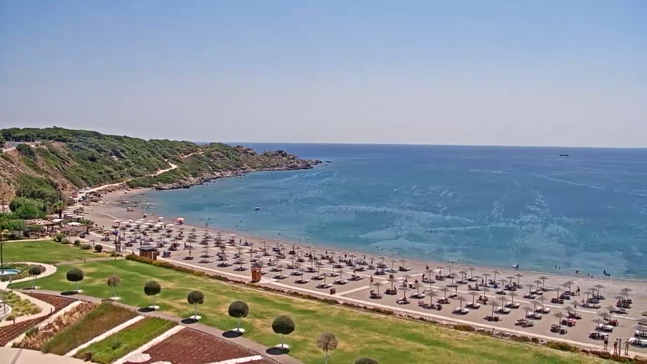 Rhodes, Paralia Faliraki Beach Northeast End Live Cam - Ammoudes, Rhodes (Ródos), Dodacanese,  South Aegean (Periféreia Notíou Aigaíou), Greece