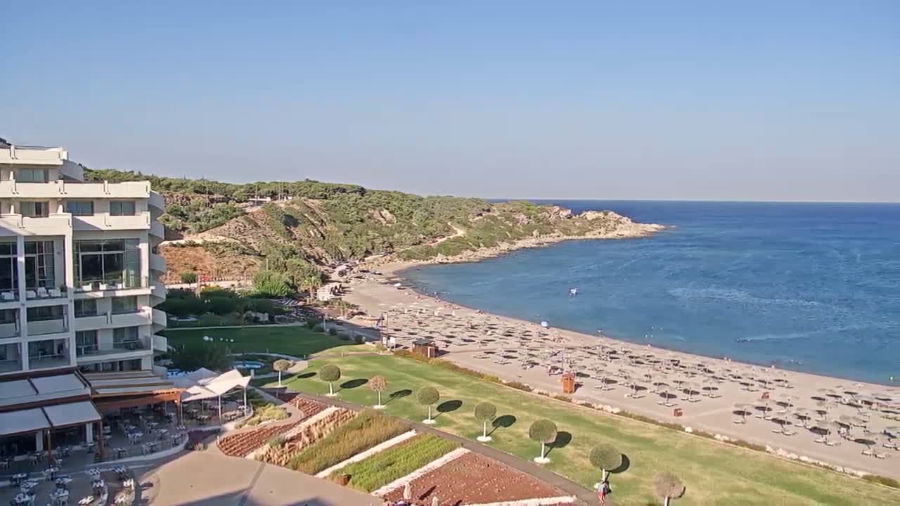 Rhodes, Paralia Faliraki Beach Northeast End Live Cam - Ammoudes, Rhodes (Ródos), Dodacanese,  South Aegean (Periféreia Notíou Aigaíou), Greece