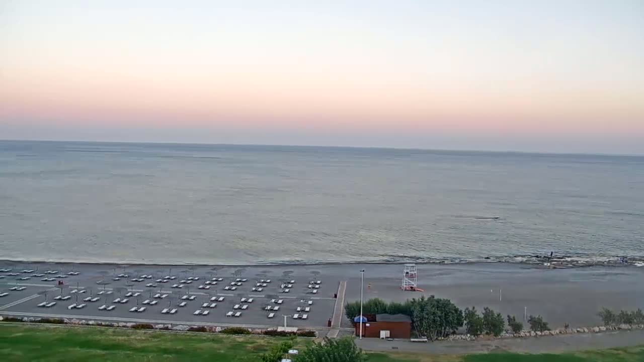 Rhodes, Paralia Faliraki Beach Northeast End Live Cam - Ammoudes, Rhodes (Ródos), Dodacanese,  South Aegean (Periféreia Notíou Aigaíou), Greece