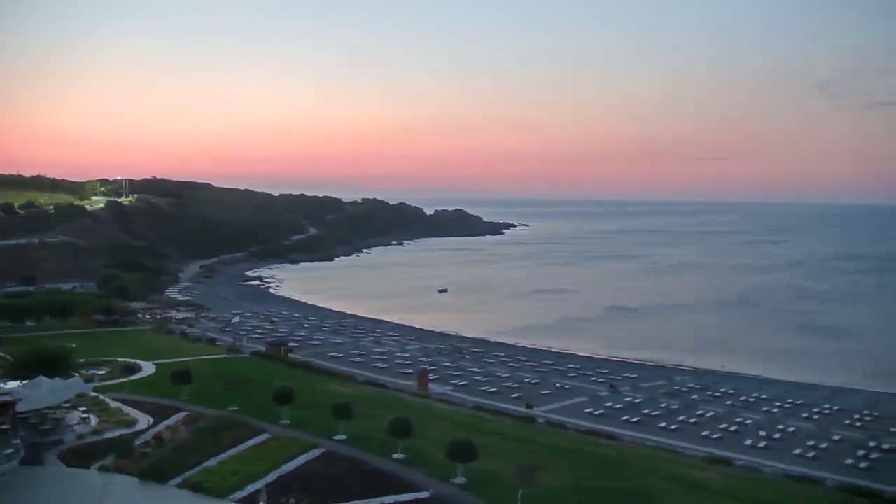 Rhodes, Paralia Faliraki Beach Northeast End Live Cam - Ammoudes, Rhodes (Ródos), Dodacanese,  South Aegean (Periféreia Notíou Aigaíou), Greece