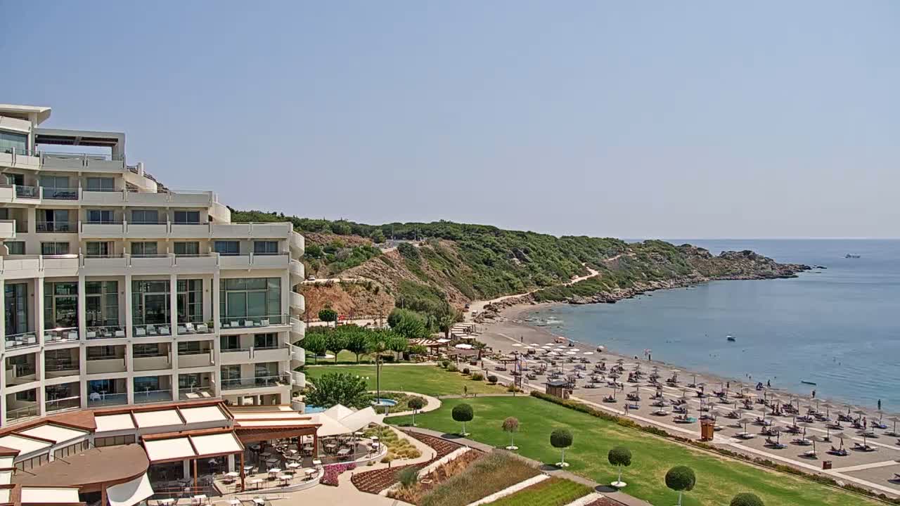 Rhodes, Paralia Faliraki Beach Northeast End Live Cam - Ammoudes, Rhodes (Ródos), Dodacanese,  South Aegean (Periféreia Notíou Aigaíou), Greece