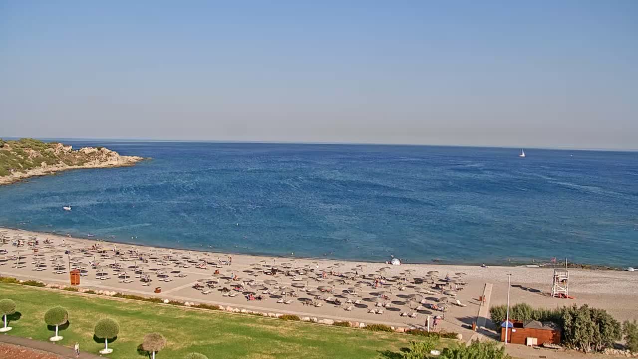 Rhodes, Paralia Faliraki Beach Northeast End Live Cam - Ammoudes, Rhodes (Ródos), Dodacanese,  South Aegean (Periféreia Notíou Aigaíou), Greece