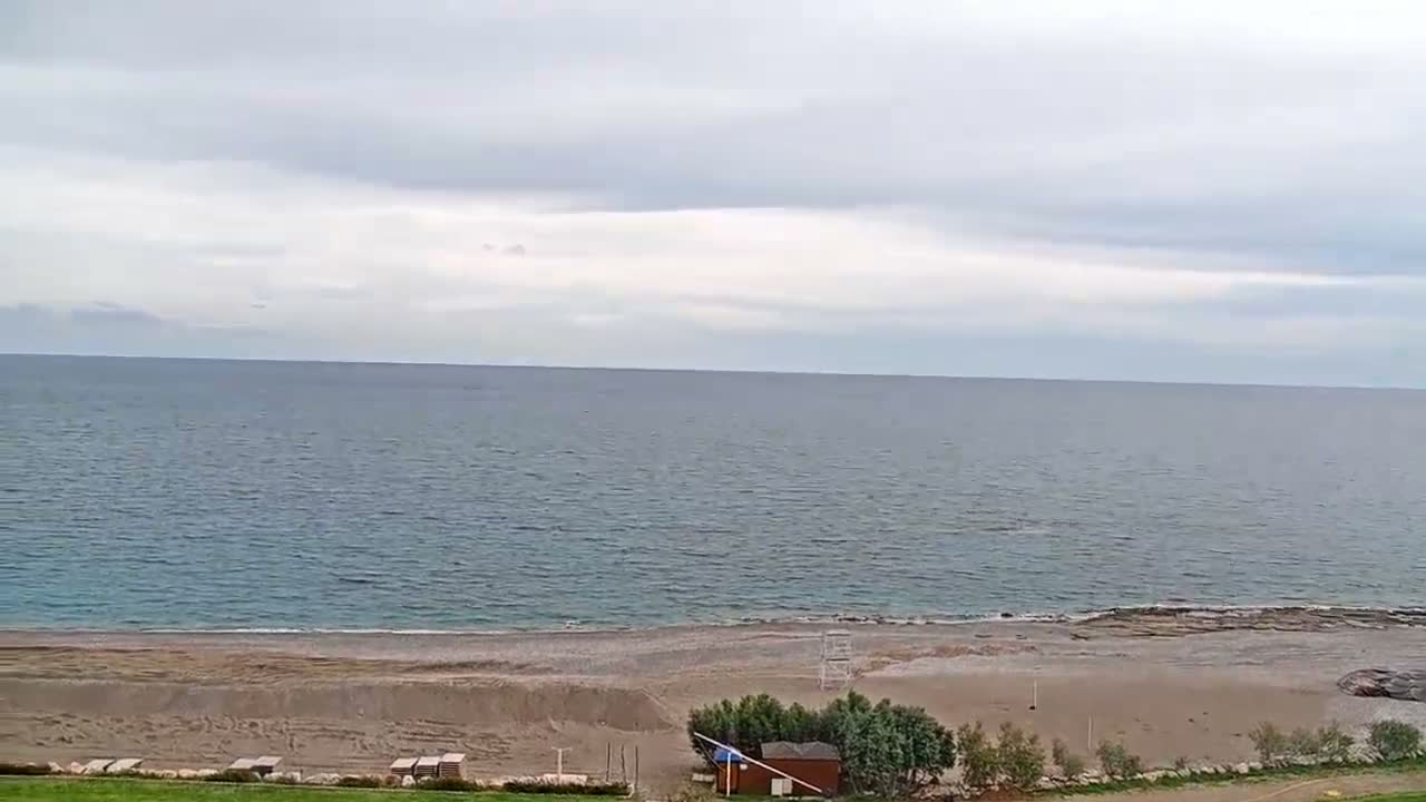 Rhodes, Paralia Faliraki Beach Northeast End Live Cam - Ammoudes, Rhodes (Ródos), Dodacanese,  South Aegean (Periféreia Notíou Aigaíou), Greece