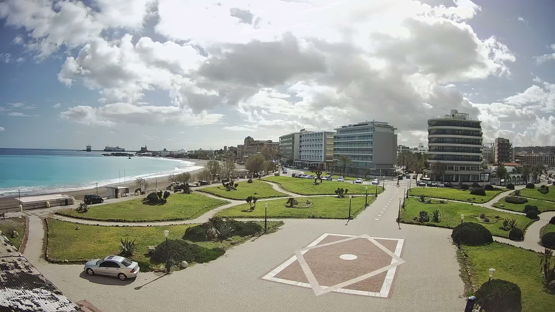 Rhodes, Paralia Enidriou Beach & Platia Enidriou Plaza Live Cam - Elli Beach, Rhodes (Ródos), Dodacanese, South Aegean (Periféreia Notíou Aigaíou), Greece