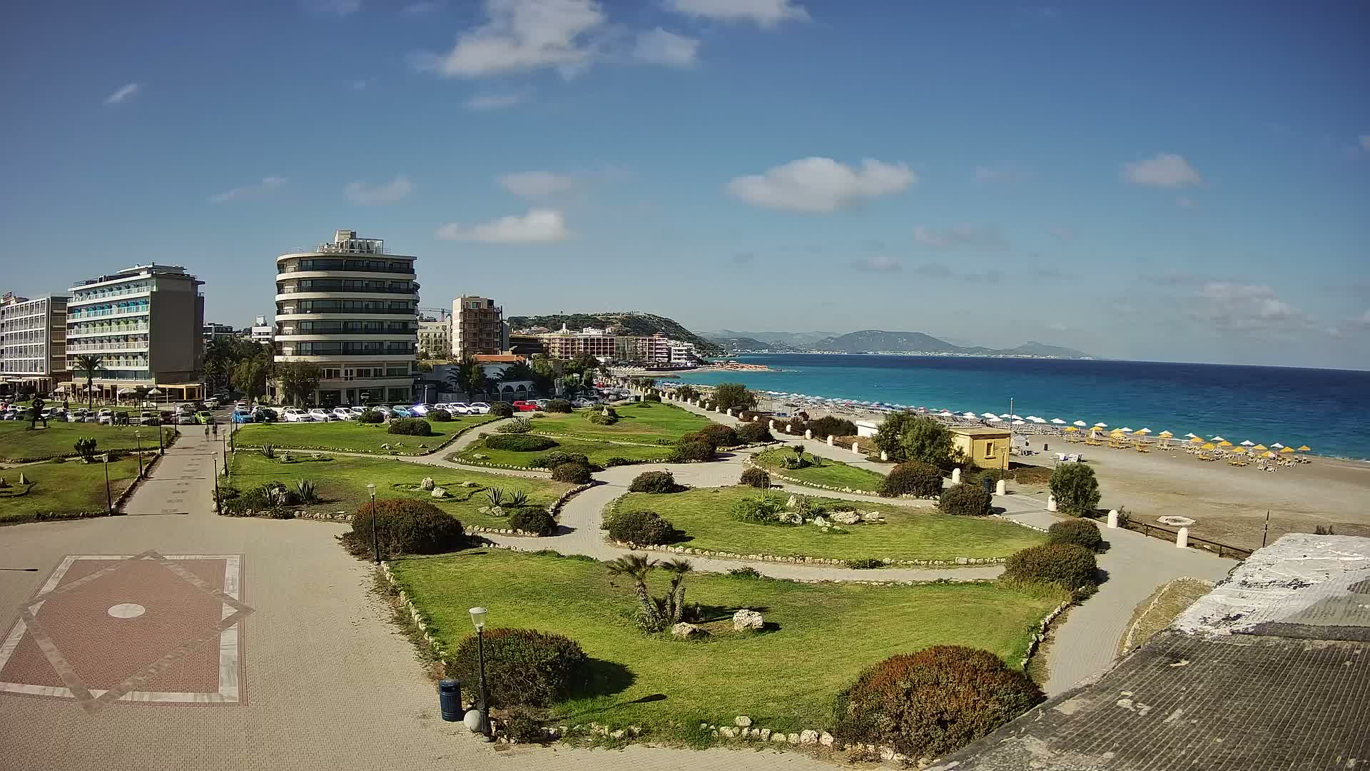 Rhodes, Paralia Elli Beach & Platia Enidriou Plaza Live Cam - Elli Beach, Rhodes (Ródos), Dodacanese, South Aegean (Periféreia Notíou Aigaíou), Greece
