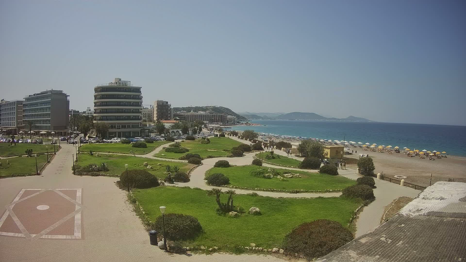 Rhodes, Paralia Elli Beach & Platia Enidriou Plaza Live Cam - Elli Beach, Rhodes (Ródos), Dodacanese, South Aegean (Periféreia Notíou Aigaíou), Greece