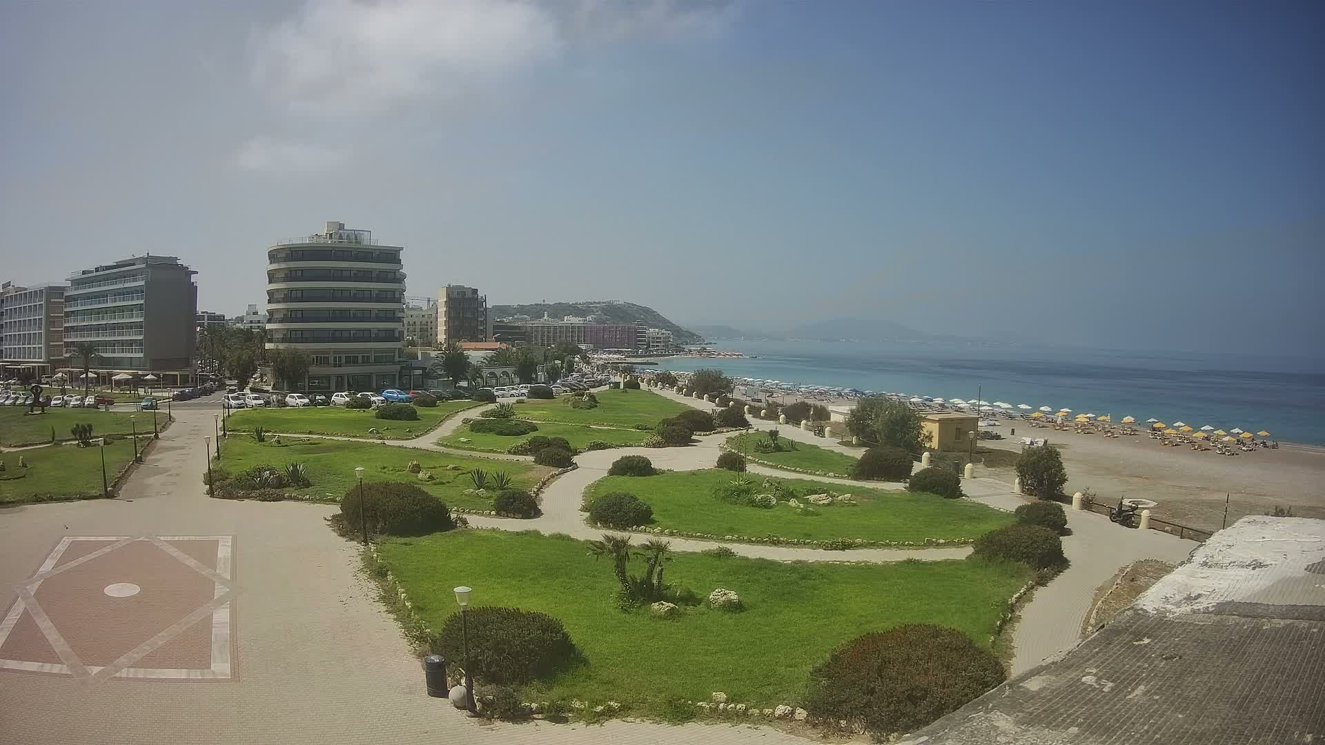 Rhodes, Paralia Elli Beach & Platia Enidriou Plaza Live Cam - Elli Beach, Rhodes (Ródos), Dodacanese, South Aegean (Periféreia Notíou Aigaíou), Greece