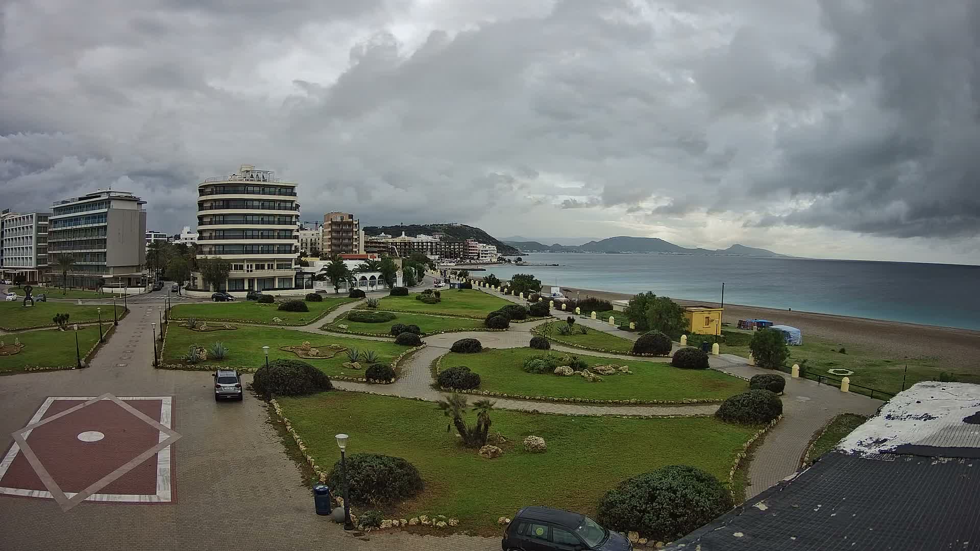 Rhodes, Paralia Elli Beach & Platia Enidriou Plaza Live Cam - Elli Beach, Rhodes (Ródos), Dodacanese, South Aegean (Periféreia Notíou Aigaíou), Greece