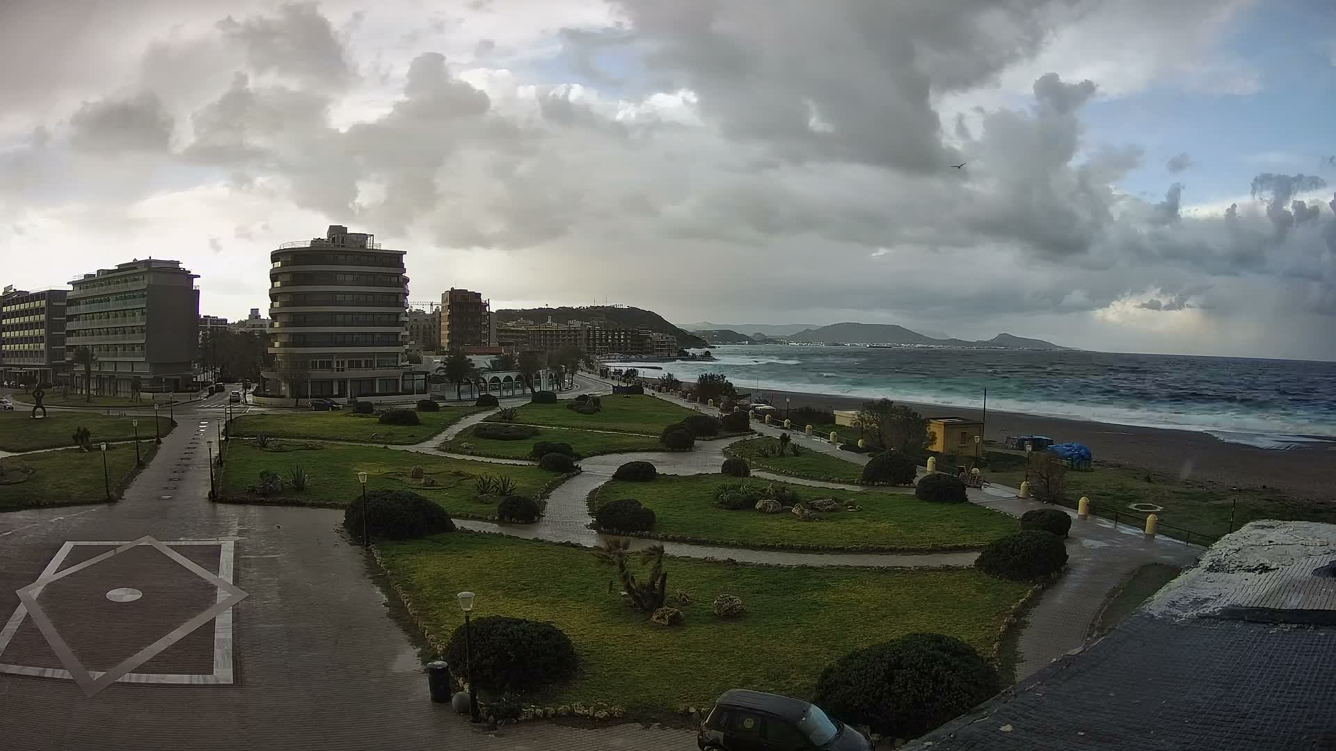 Rhodes, Paralia Elli Beach & Platia Enidriou Plaza Live Cam - Elli Beach, Rhodes (Ródos), Dodacanese, South Aegean (Periféreia Notíou Aigaíou), Greece