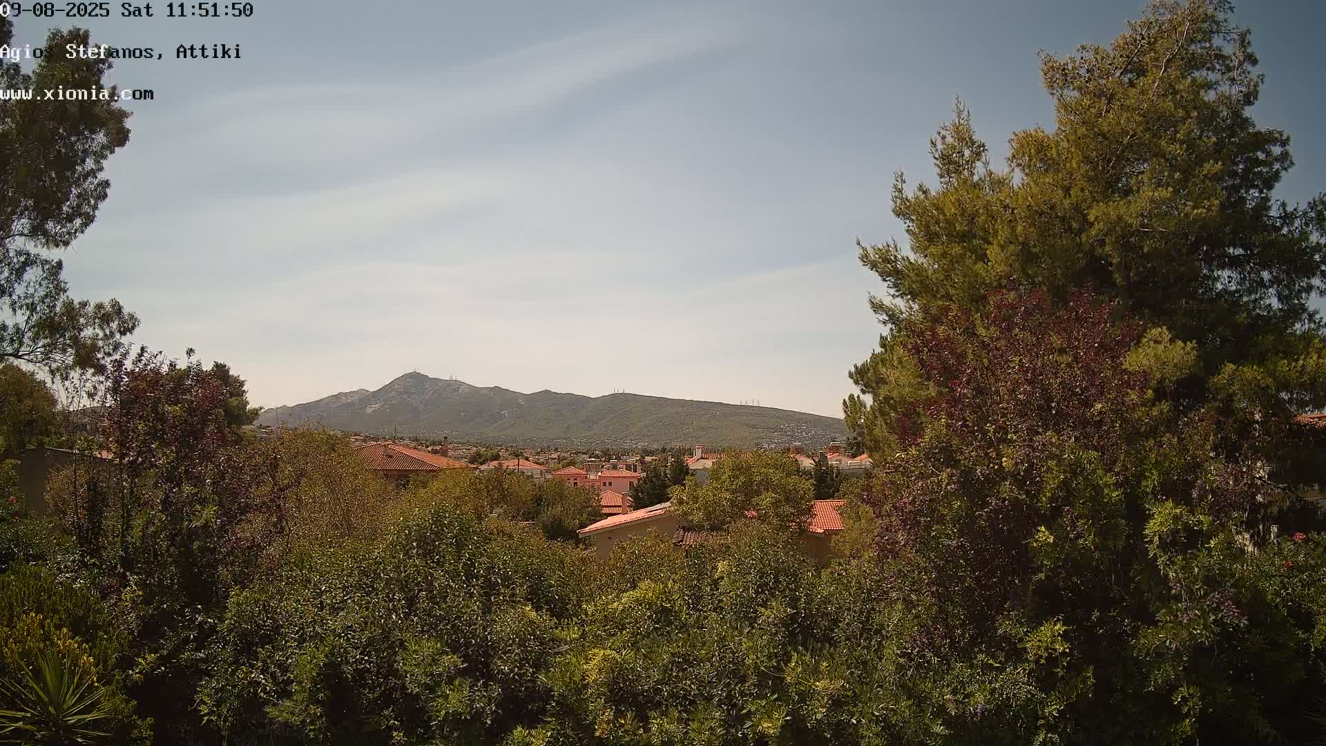 Dionysos, Agios Stefanos Skyline & Mount Pentelicus (Pentéli Óros) Live Cam  - Dasos Kouremenou, Ágios Stéfanos, Diónysos, East Attica (Anatolikís Attikís) , Athens (Athína), Attica (Attikí), Greece