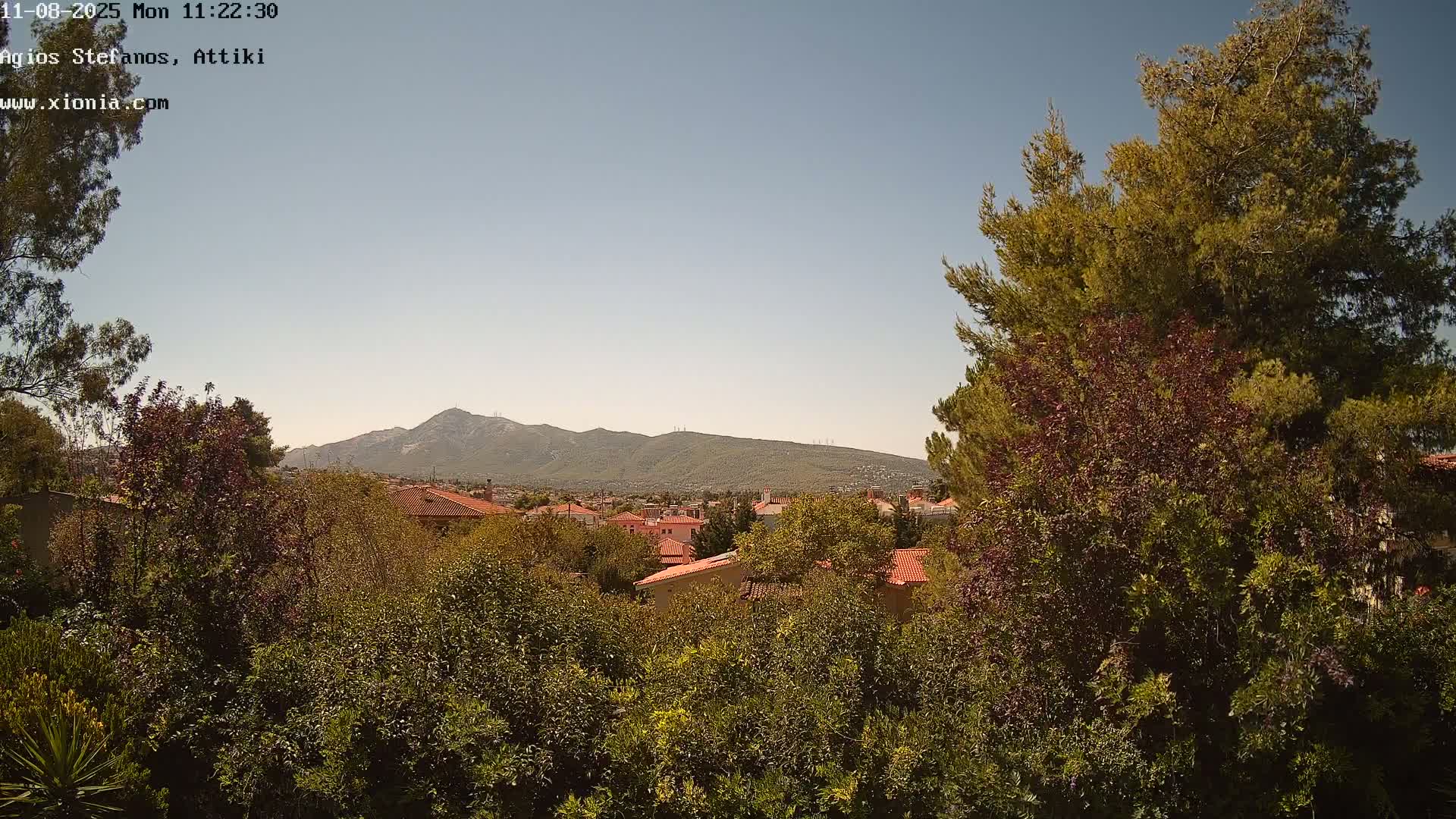 Dionysos, Agios Stefanos Skyline & Mount Pentelicus (Pentéli Óros) Live Cam  - Dasos Kouremenou, Ágios Stéfanos, Diónysos, East Attica (Anatolikís Attikís) , Athens (Athína), Attica (Attikí), Greece