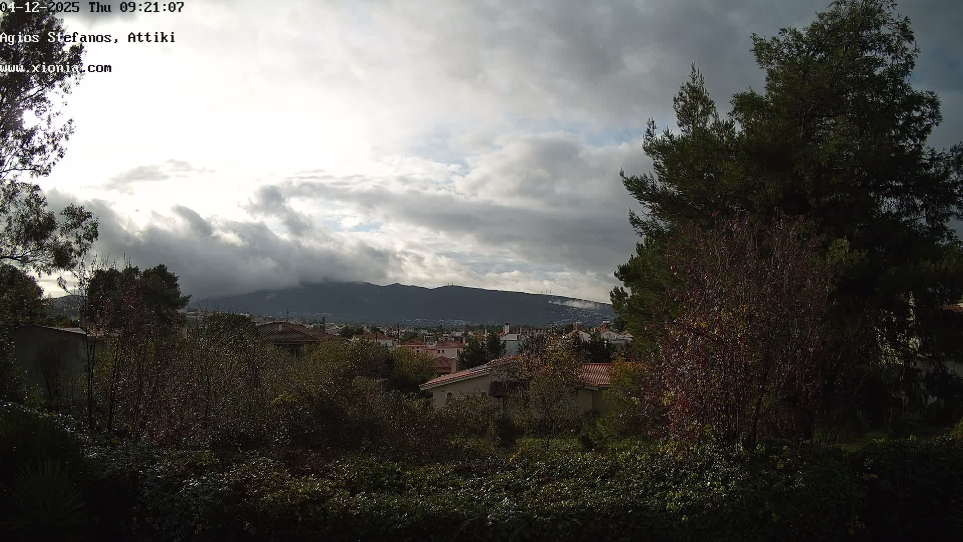 Dionysos, Agios Stefanos Skyline & Mount Pentelicus (Pentéli Óros) Live Cam  - Dasos Kouremenou, Ágios Stéfanos, Diónysos, East Attica (Anatolikís Attikís) , Athens (Athína), Attica (Attikí), Greece