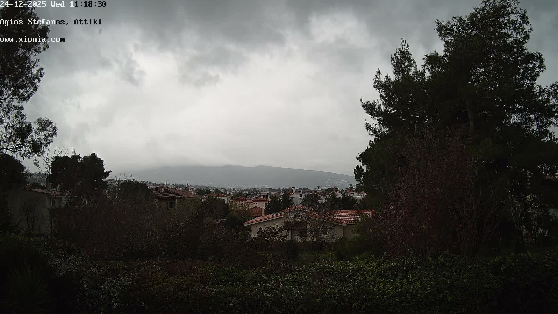 Dionysos, Agios Stefanos Skyline & Mount Pentelicus (Pentéli Óros) Live Cam  - Dasos Kouremenou, Ágios Stéfanos, Diónysos, East Attica (Anatolikís Attikís) , Athens (Athína), Attica (Attikí), Greece