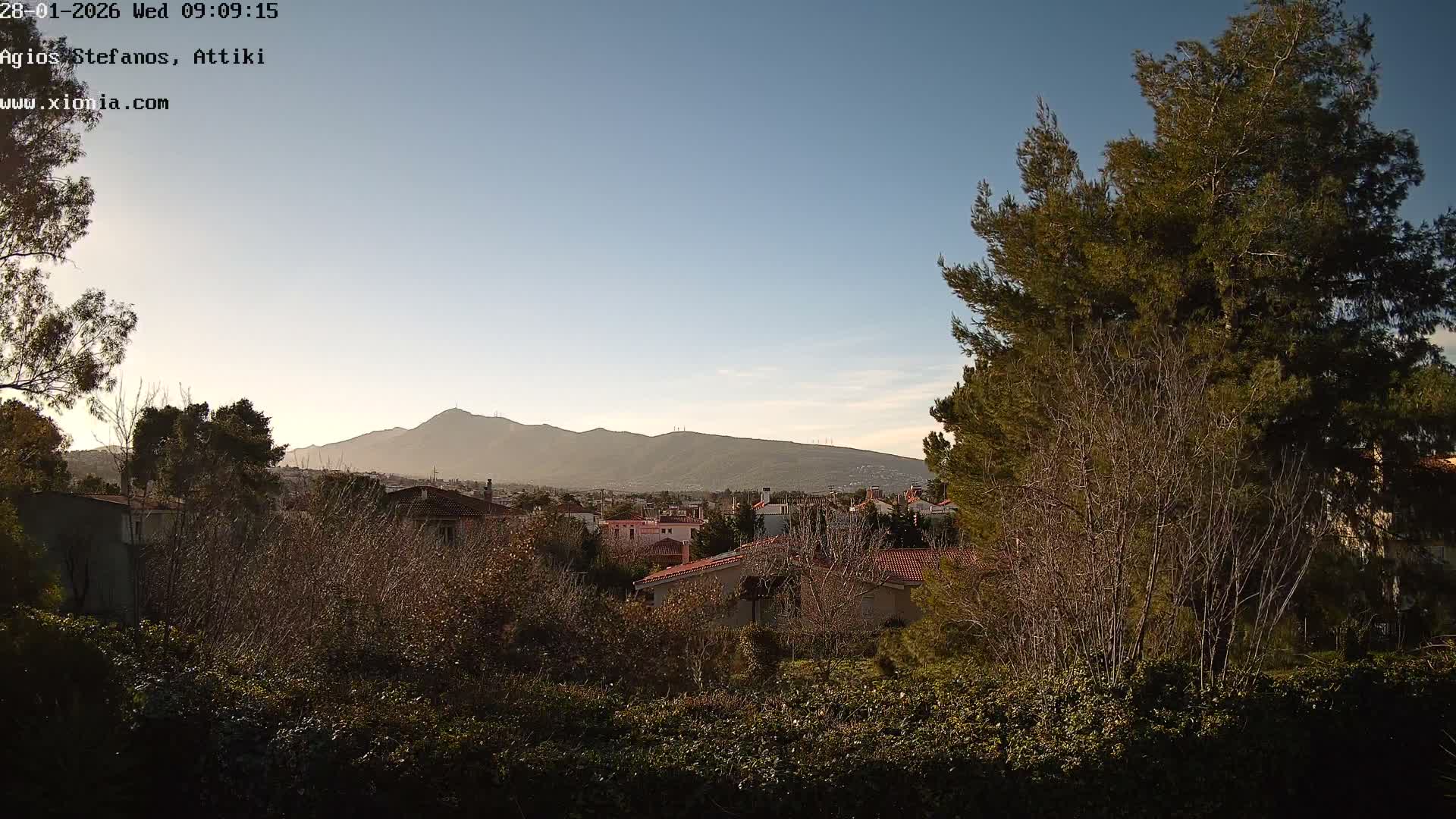 Dionysos, Agios Stefanos Skyline & Mount Pentelicus (Pentéli Óros) Live Cam  - Dasos Kouremenou, Ágios Stéfanos, Diónysos, East Attica (Anatolikís Attikís) , Athens (Athína), Attica (Attikí), Greece