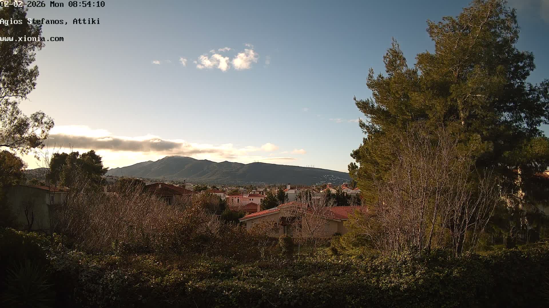 Dionysos, Agios Stefanos Skyline & Mount Pentelicus (Pentéli Óros) Live Cam  - Dasos Kouremenou, Ágios Stéfanos, Diónysos, East Attica (Anatolikís Attikís) , Athens (Athína), Attica (Attikí), Greece
