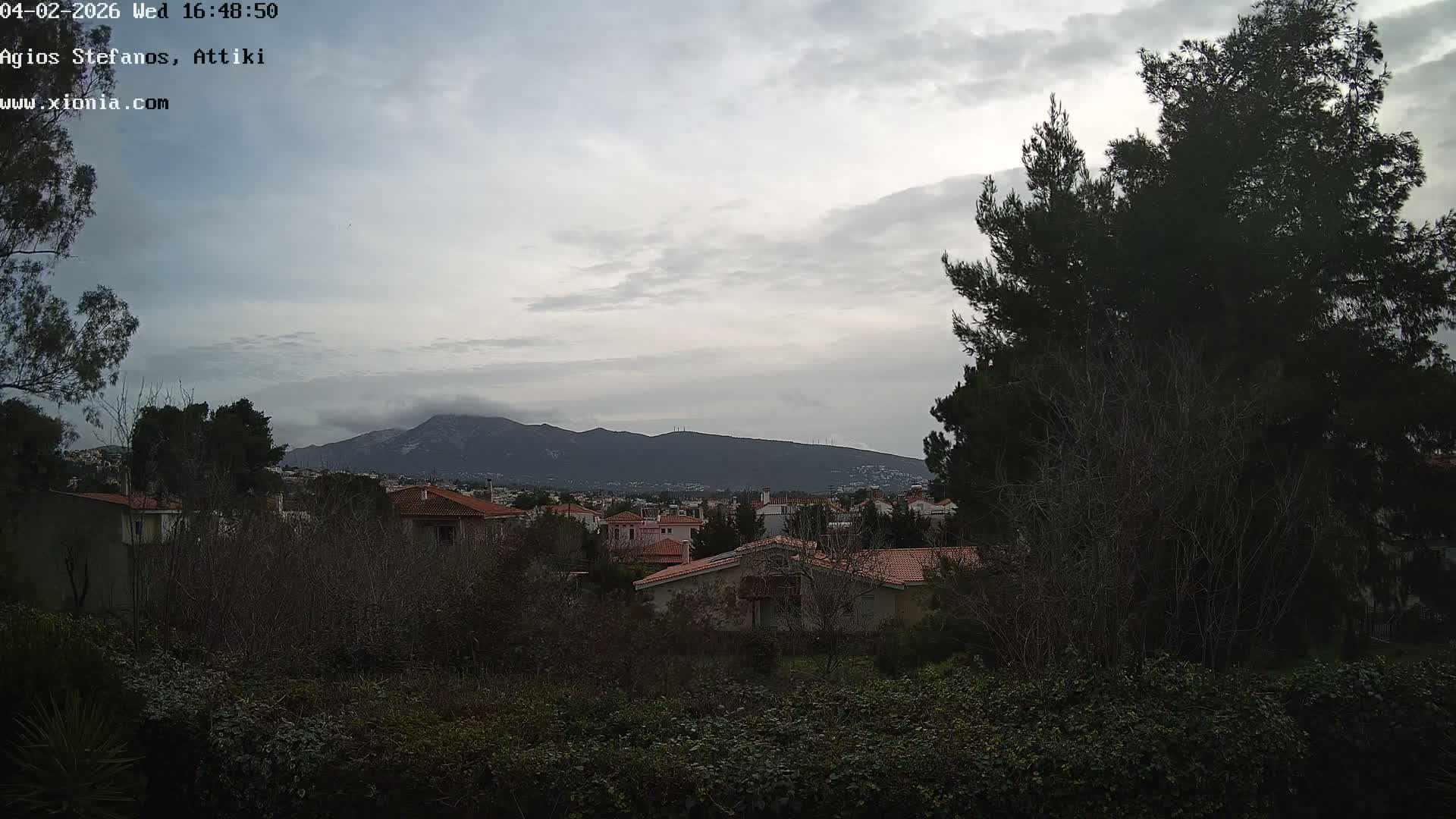 Dionysos, Agios Stefanos Skyline & Mount Pentelicus (Pentéli Óros) Live Cam  - Dasos Kouremenou, Ágios Stéfanos, Diónysos, East Attica (Anatolikís Attikís) , Athens (Athína), Attica (Attikí), Greece