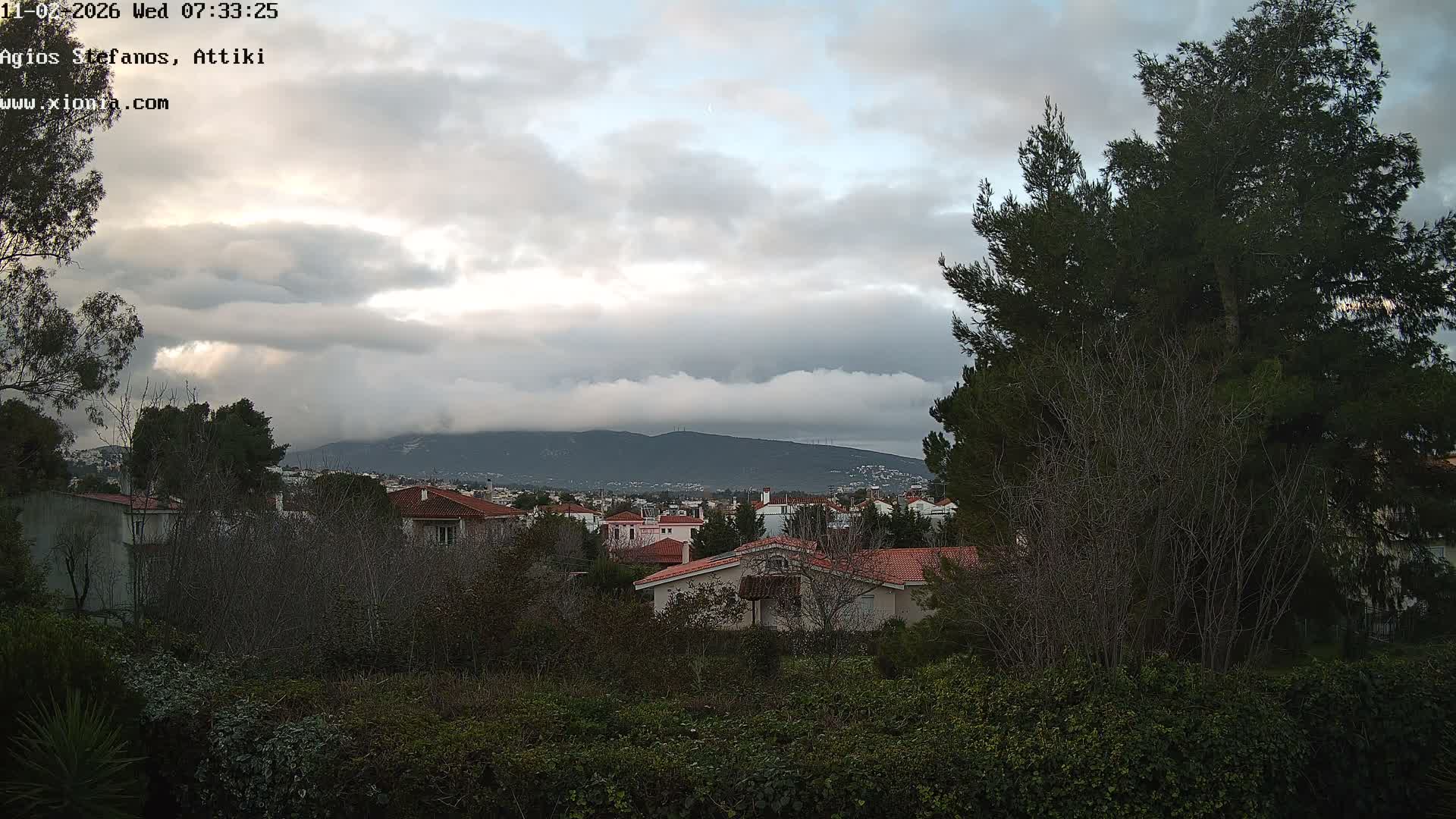 Dionysos, Agios Stefanos Skyline & Mount Pentelicus (Pentéli Óros) Live Cam  - Dasos Kouremenou, Ágios Stéfanos, Diónysos, East Attica (Anatolikís Attikís) , Athens (Athína), Attica (Attikí), Greece
