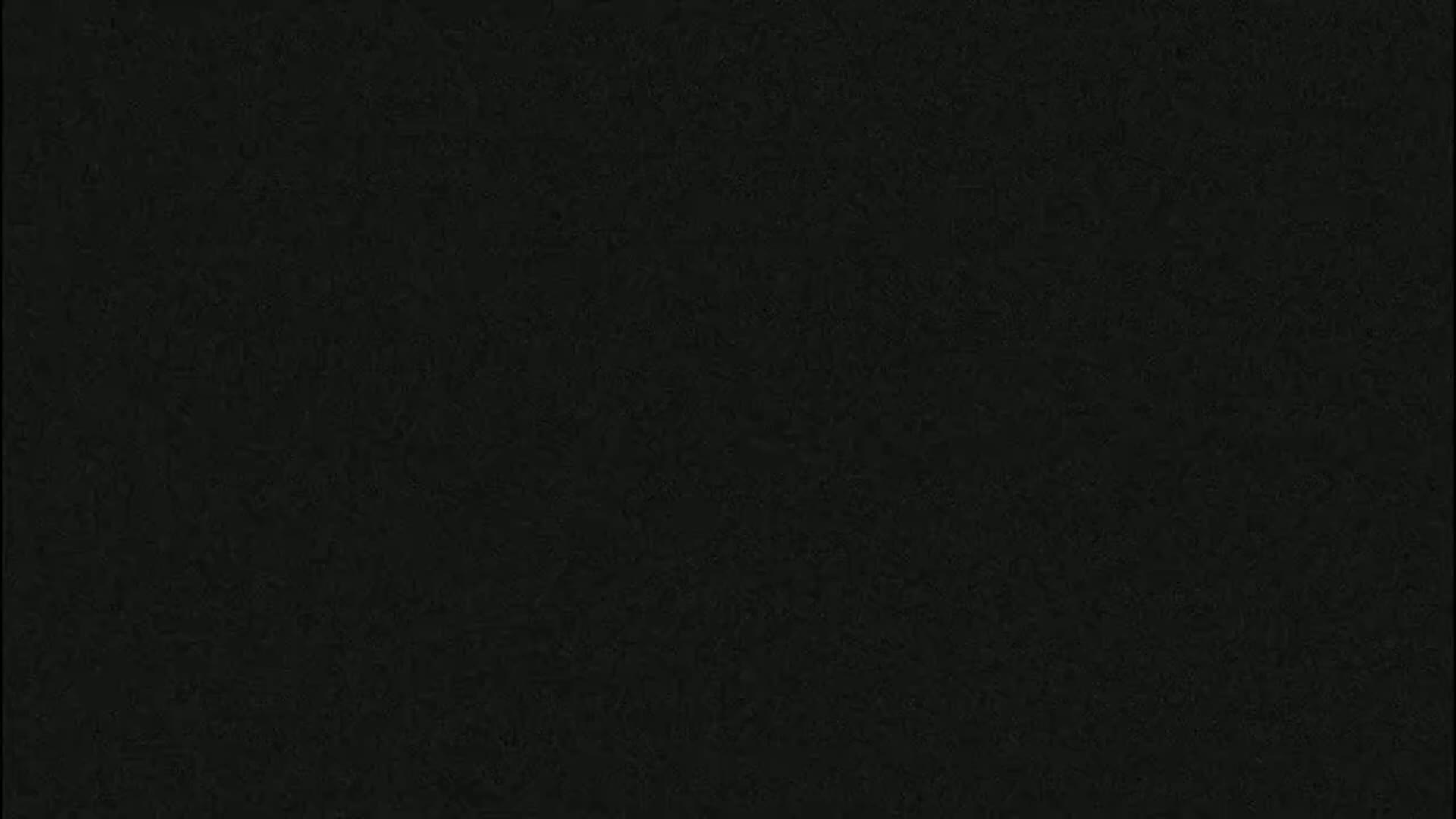 The image is a solid dark-grey background with a slightly textured surface.