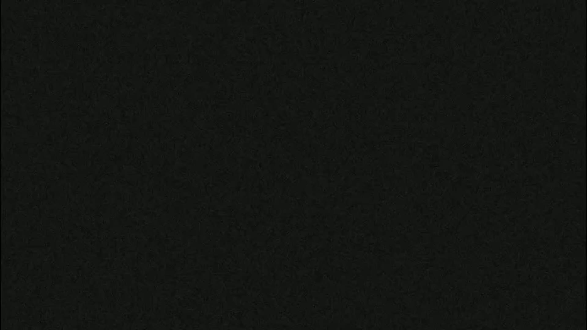 The image is a solid dark-grey background with a slightly textured surface.