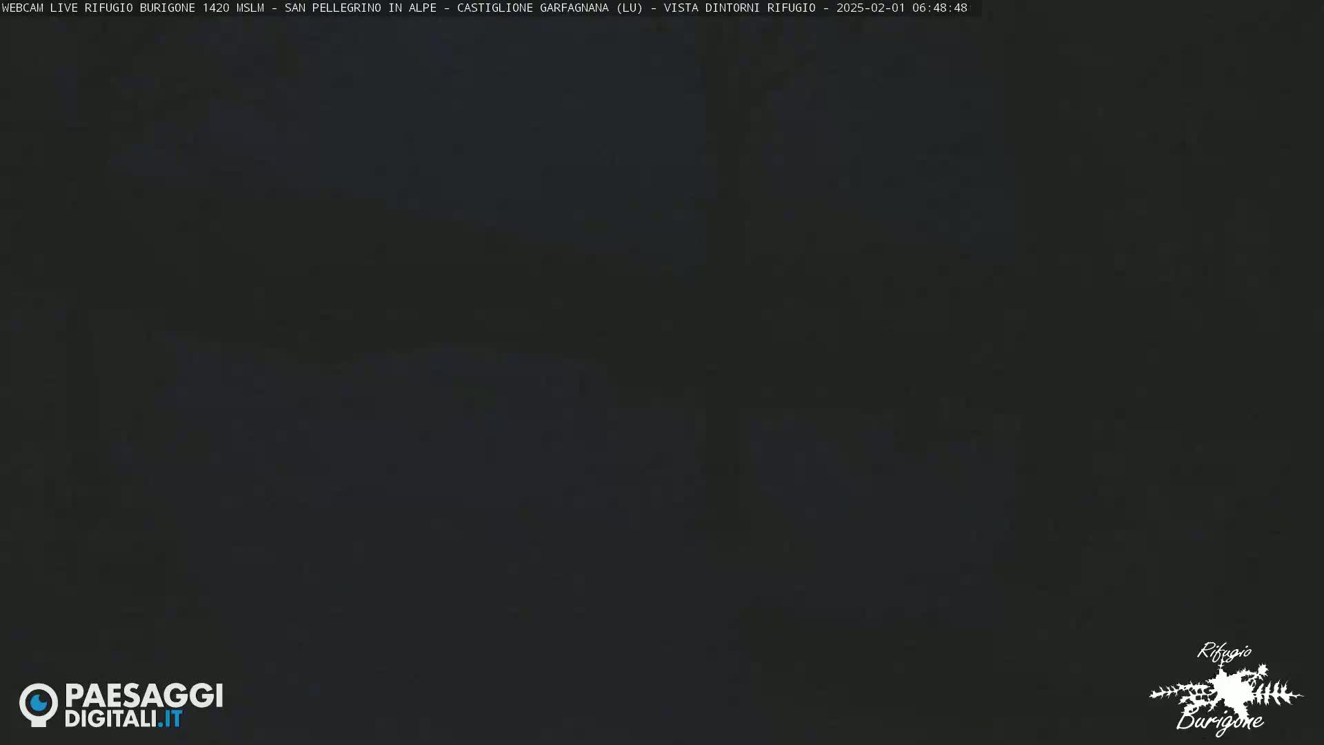 A dark, nighttime image shows a mostly black scene with little to no discernible features.