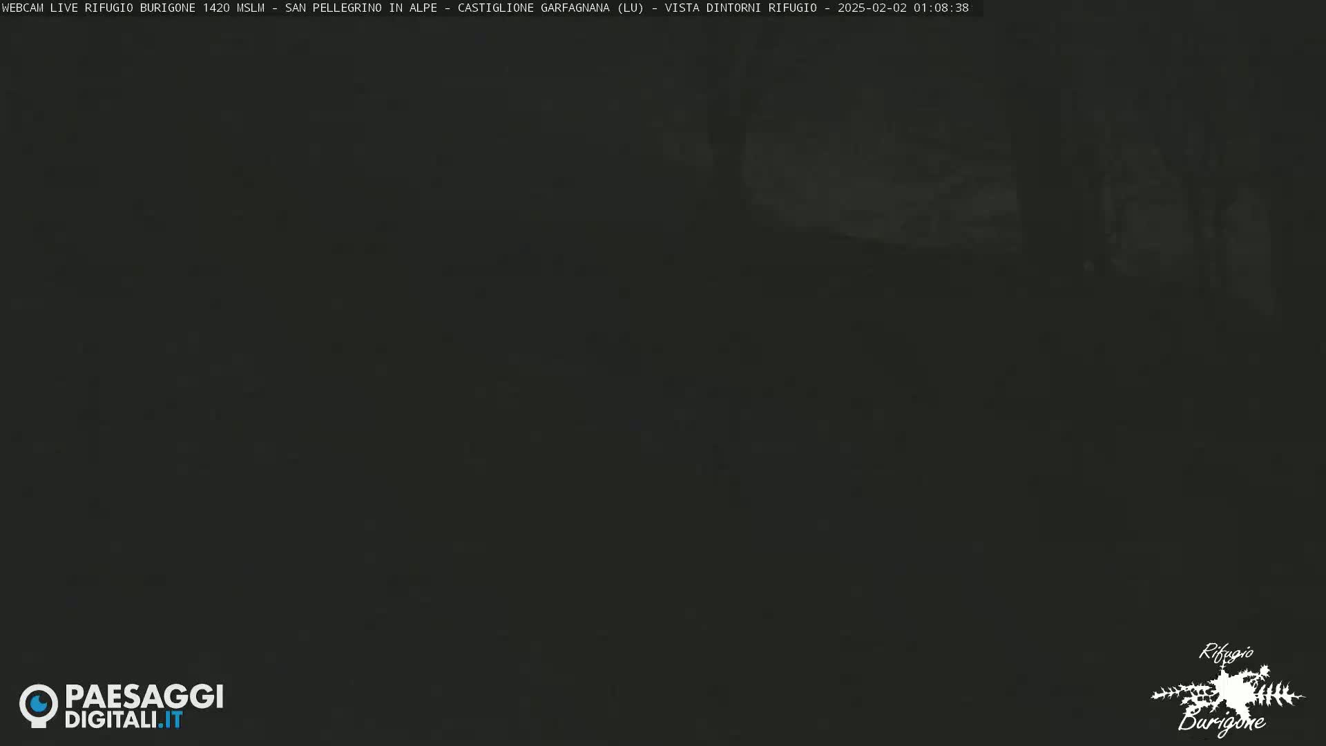 A dark, nighttime outdoor scene is visible, with poor visibility.