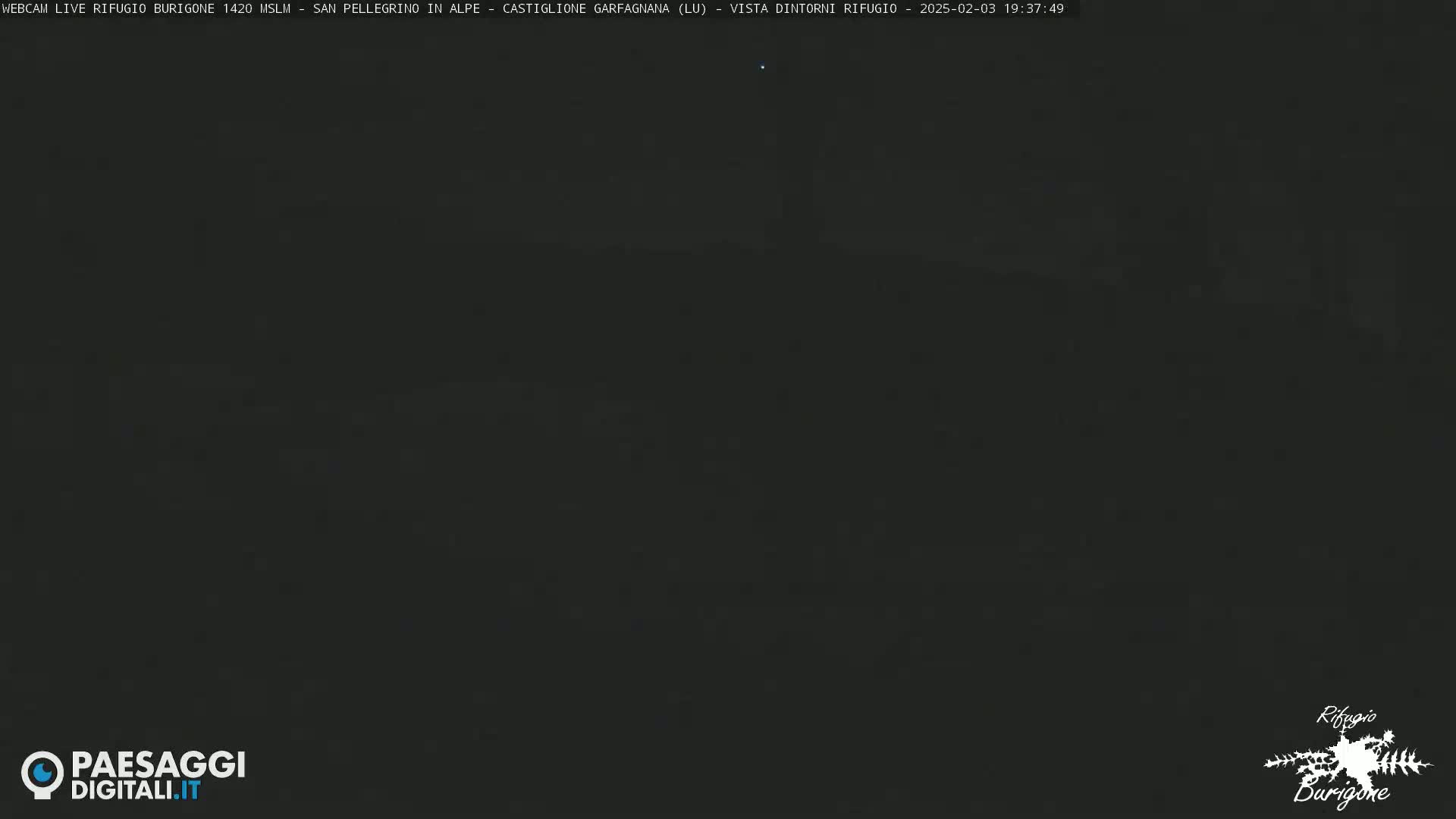 A very dark, nighttime outdoor scene is visible.