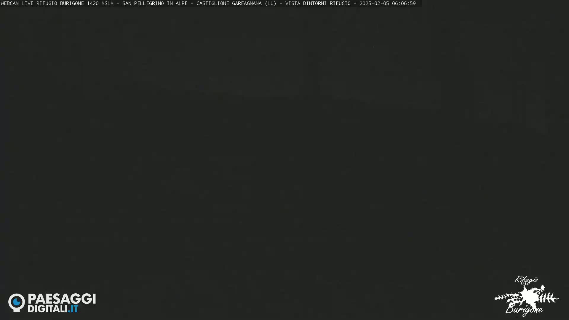 A dark, nighttime image shows an obscured view of the outdoors.