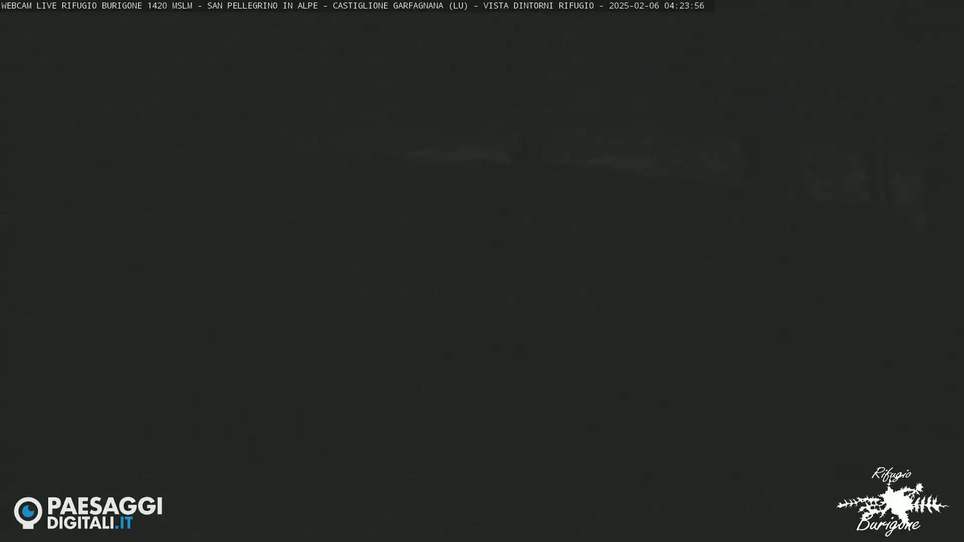 A dark, nighttime outdoor scene is visible, with poor visibility.