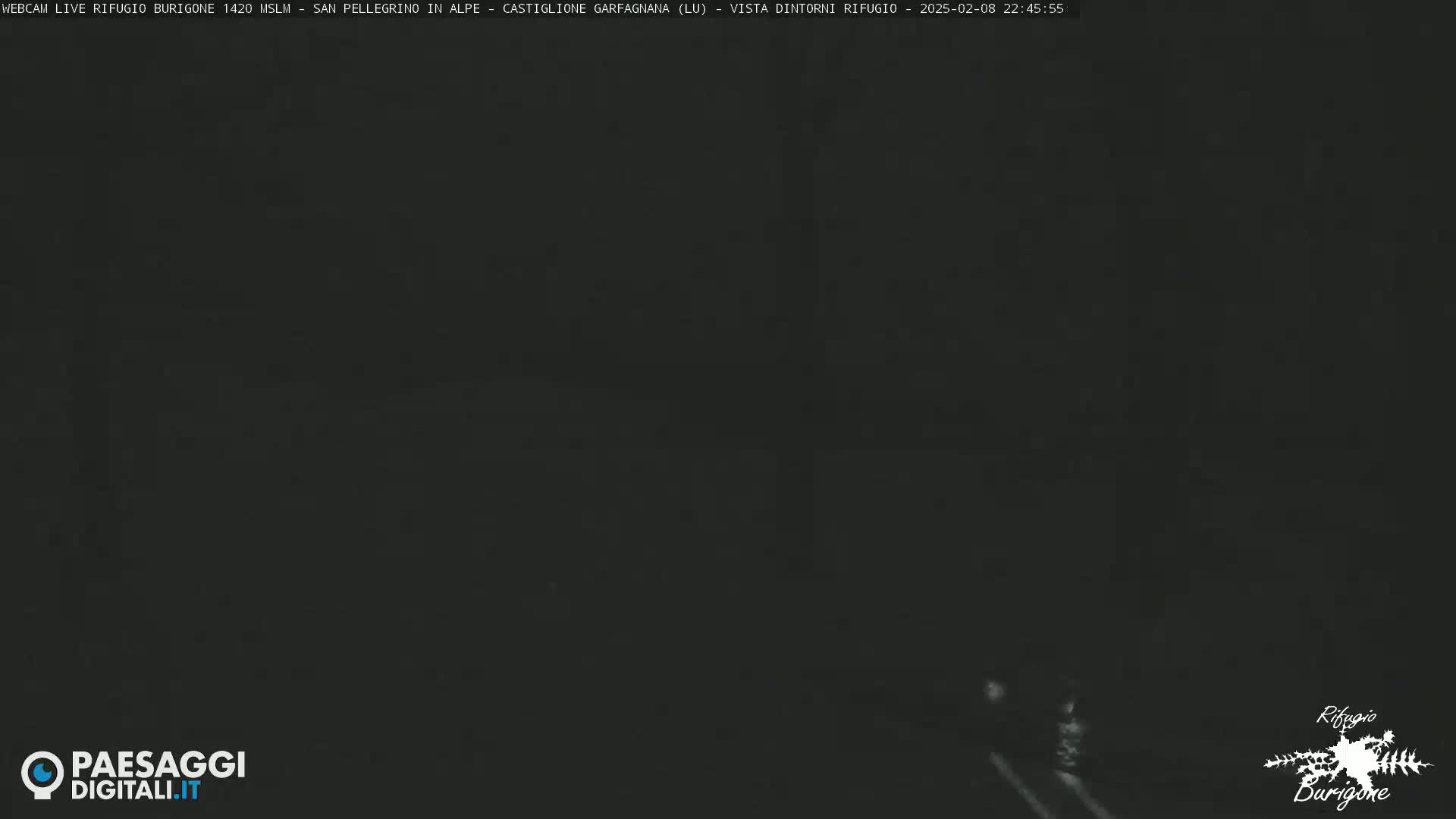 A dark, nighttime scene shows a mostly featureless, black landscape.