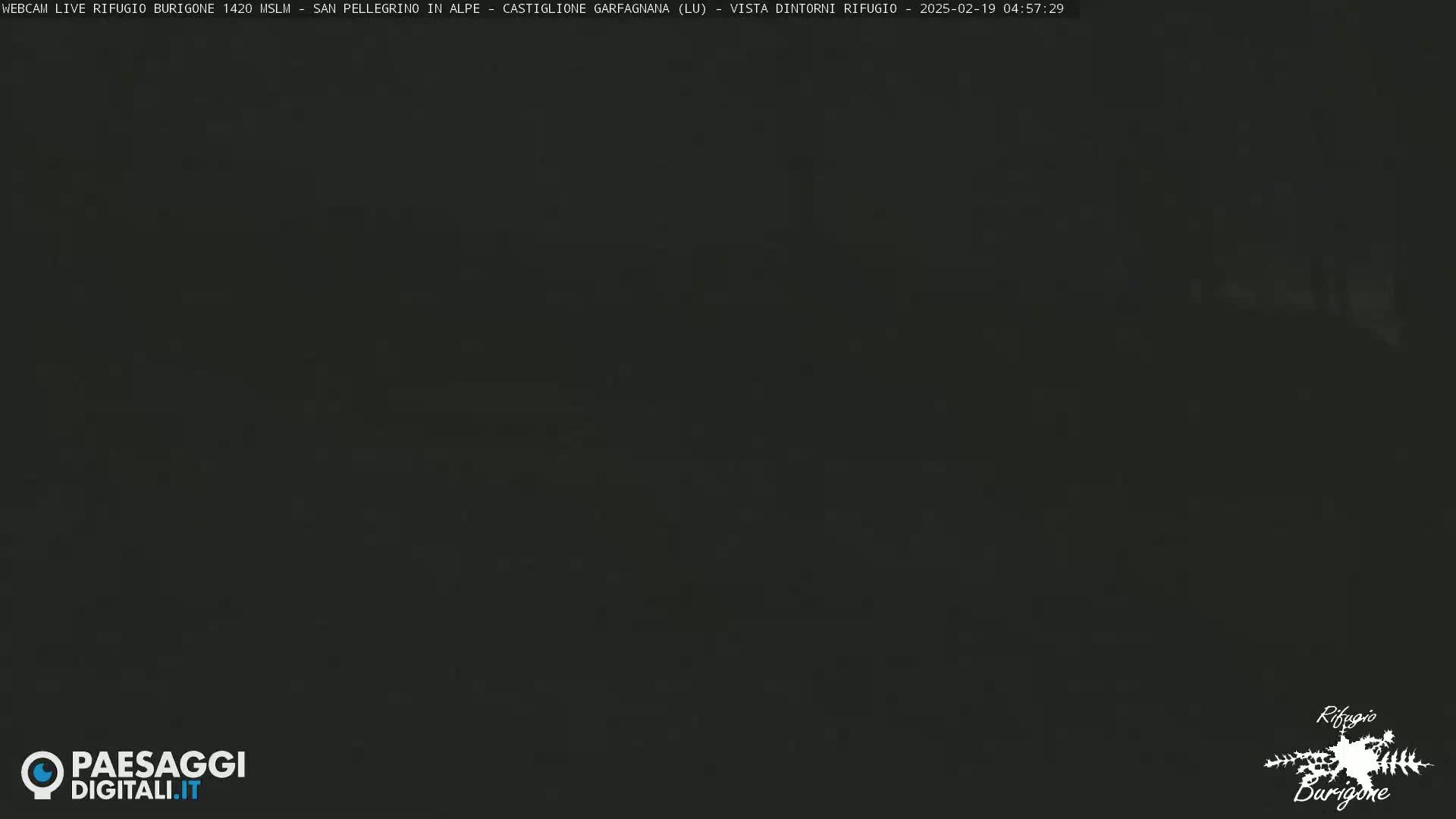 A dark, nighttime image shows an overcast sky.