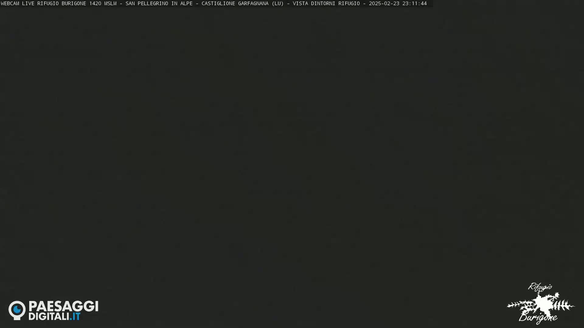 A dark, nighttime image shows a mostly black screen with some faint speckles.