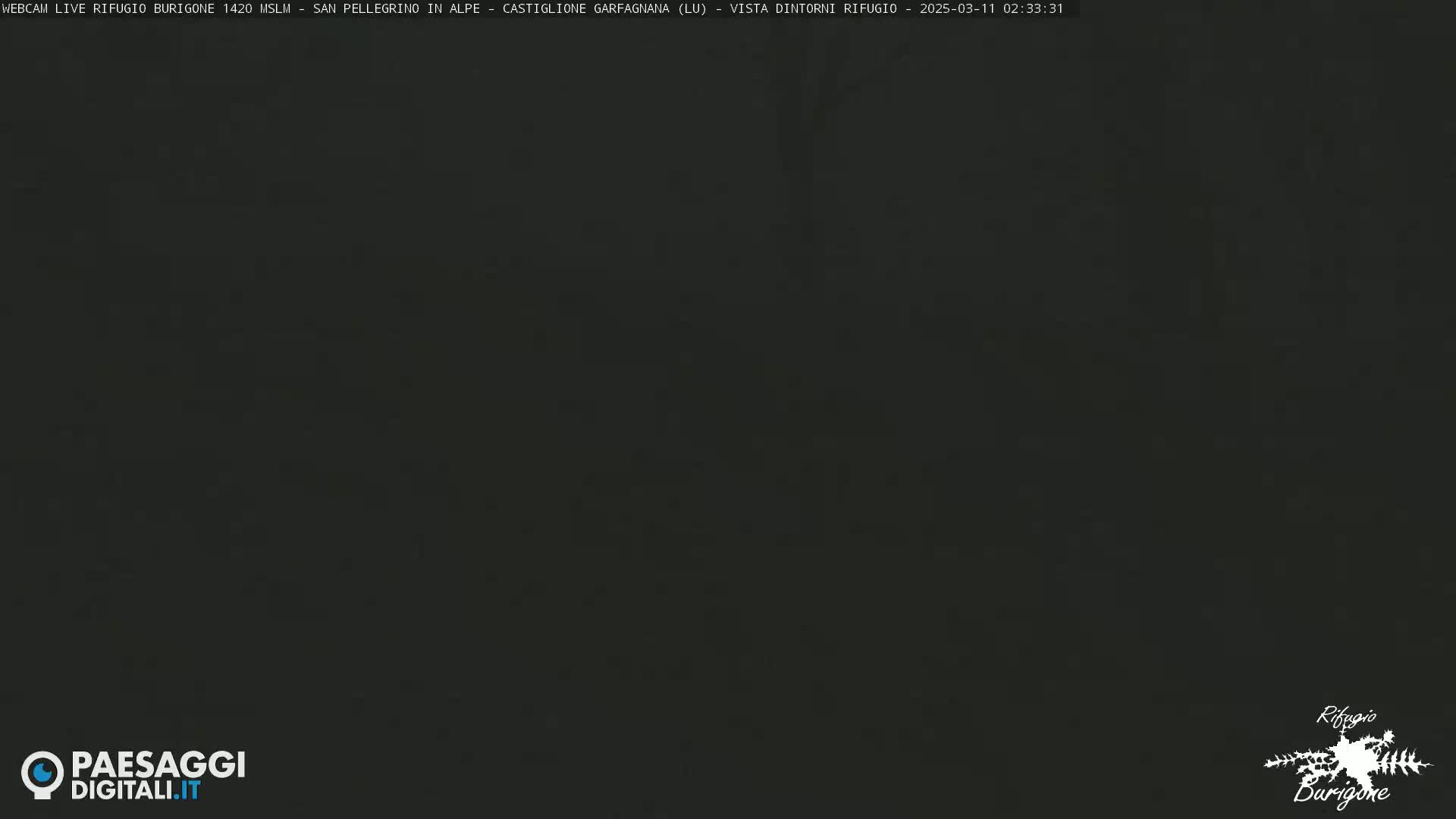 A dark, nighttime image of an overcast sky.