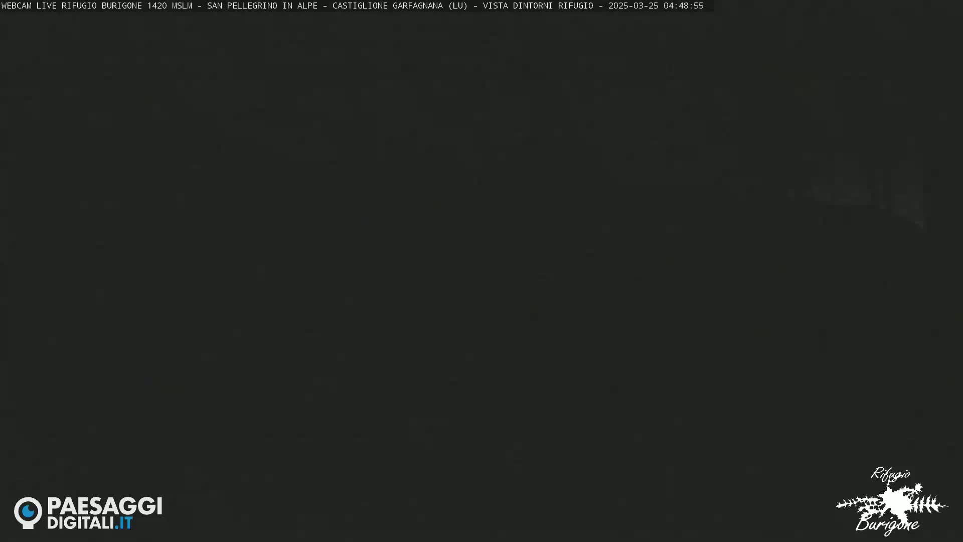 A dark, nighttime image shows an almost completely black scene.