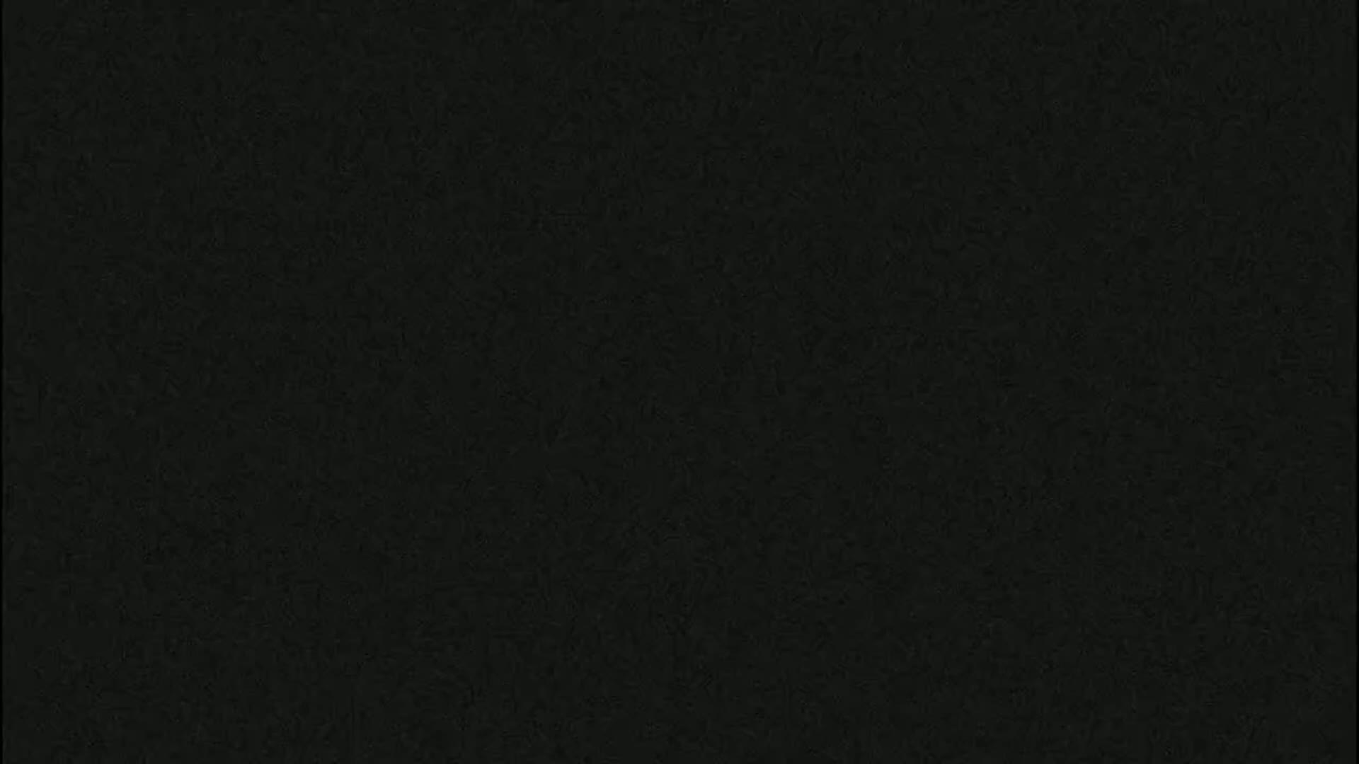 The image shows a dark gray textured surface.