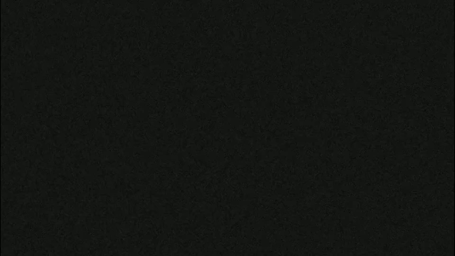 The image is a solid dark-grey/black textured background.