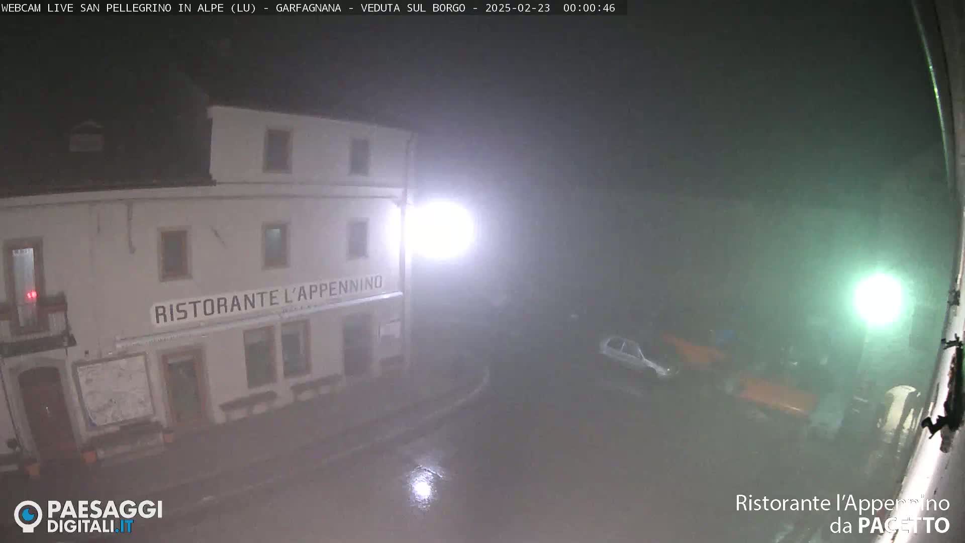 A restaurant called "Ristorante L'Appennino" is shown at night in foggy or misty conditions, with a few cars visible in the distance.