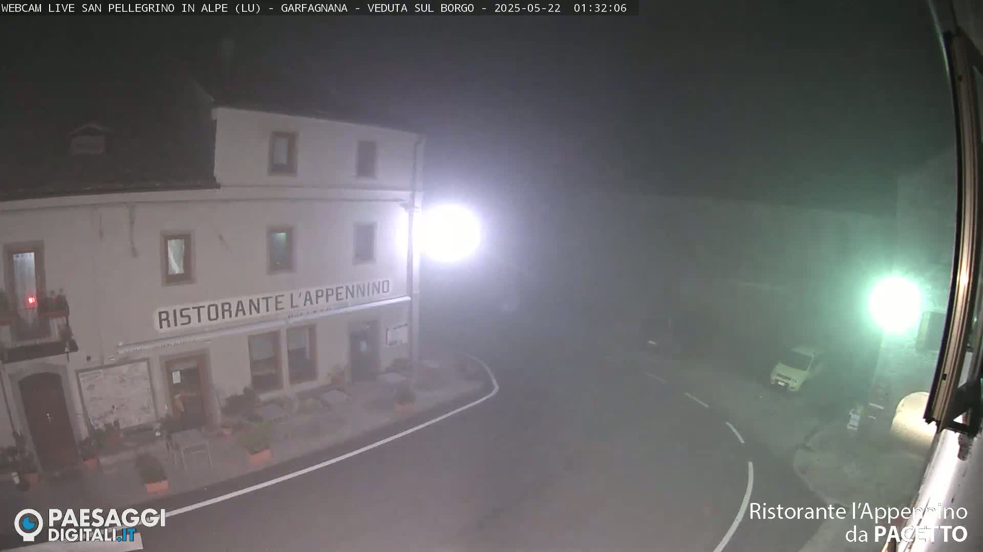 A foggy nighttime scene shows a restaurant called "Ristorante L'Appennino" and a small, light-colored vehicle parked nearby.
