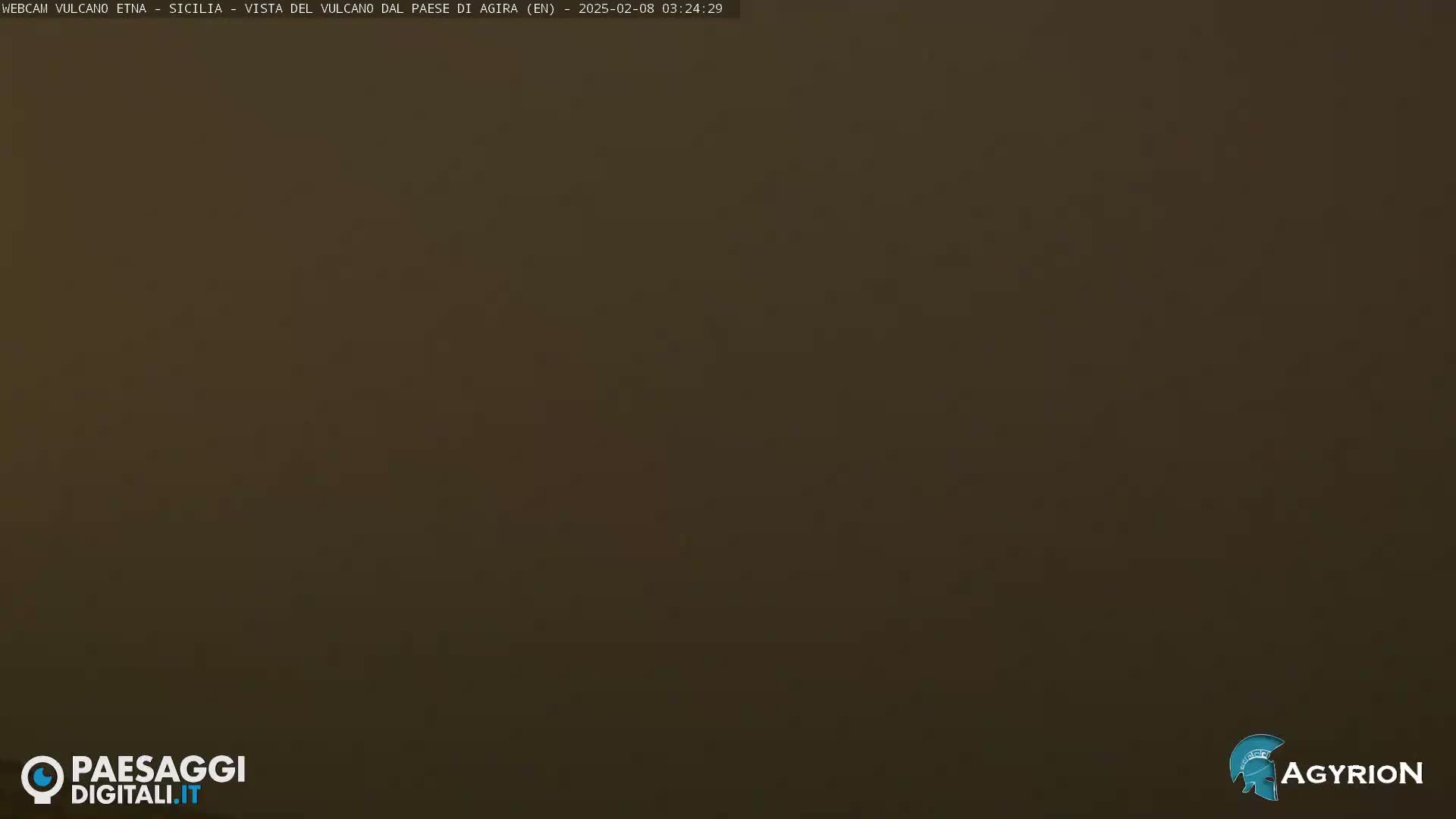 A uniformly dark brown image shows a completely overcast sky.