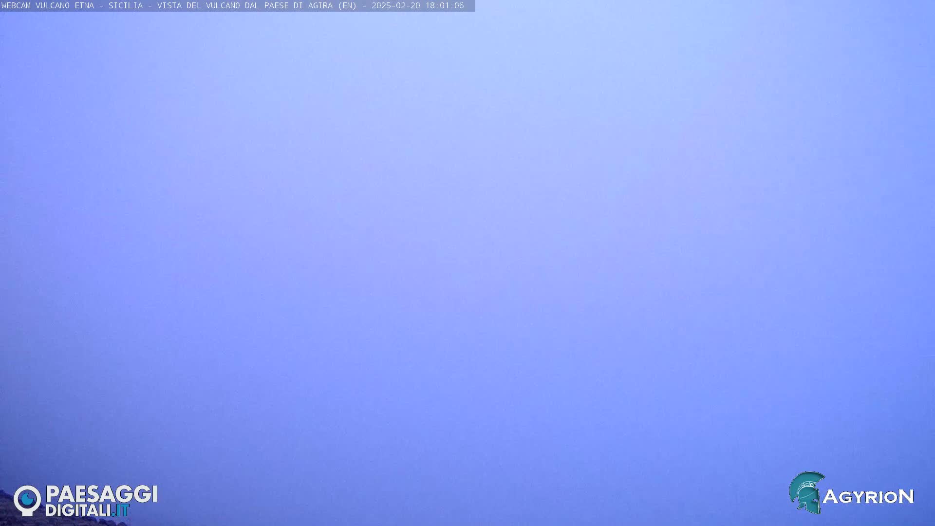 A solid, pale blue sky is visible.