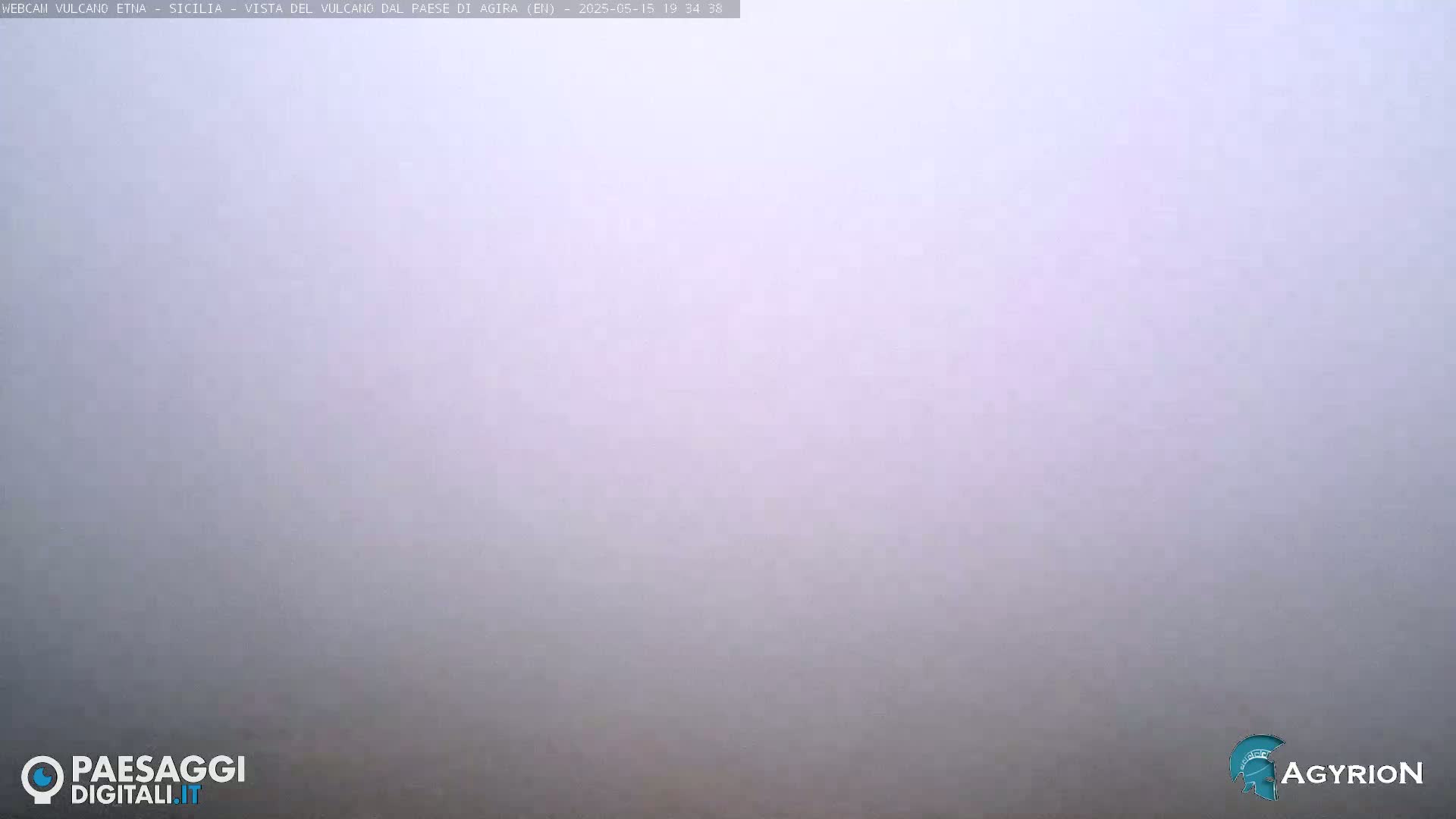 A thick, light-grey fog obscures the view.