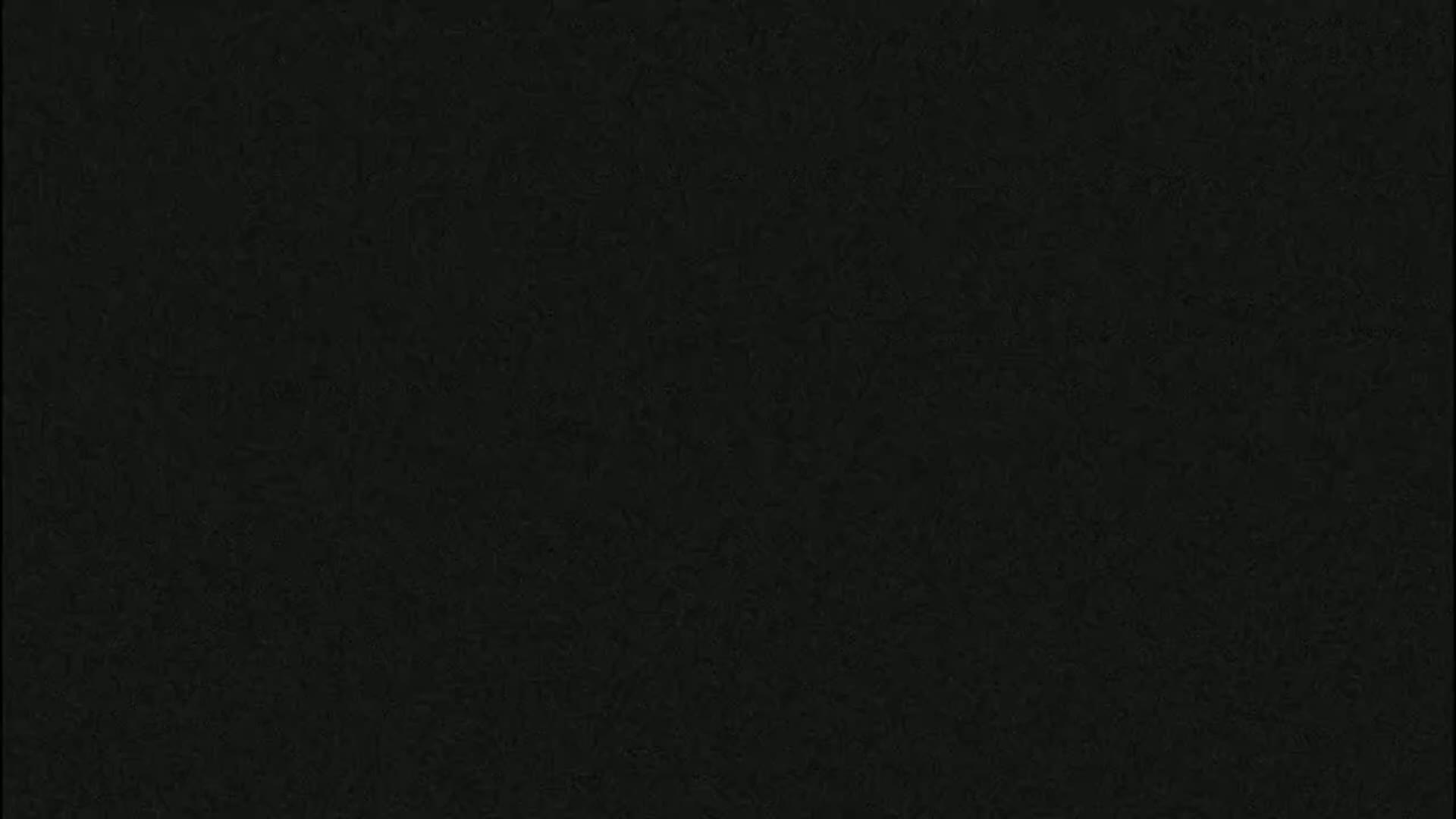 The image is a solid dark-grey/black textured background.